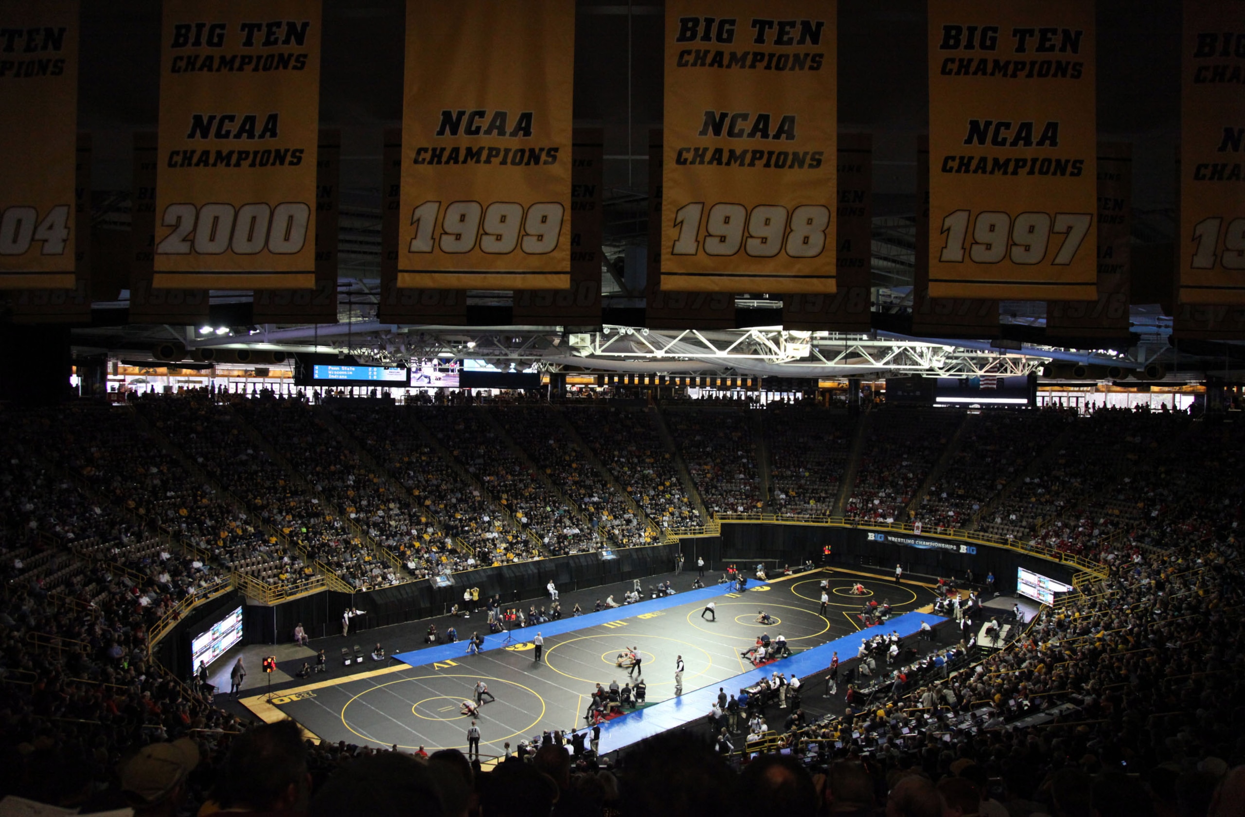 Wrestlers compete during the opening session of the Big Ten Wrestling Championships at Carver-Hawkeye Arena in Iowa City, Iowa, on Saturday, March 5, 2016. (AP Photo/Matthew Holst)