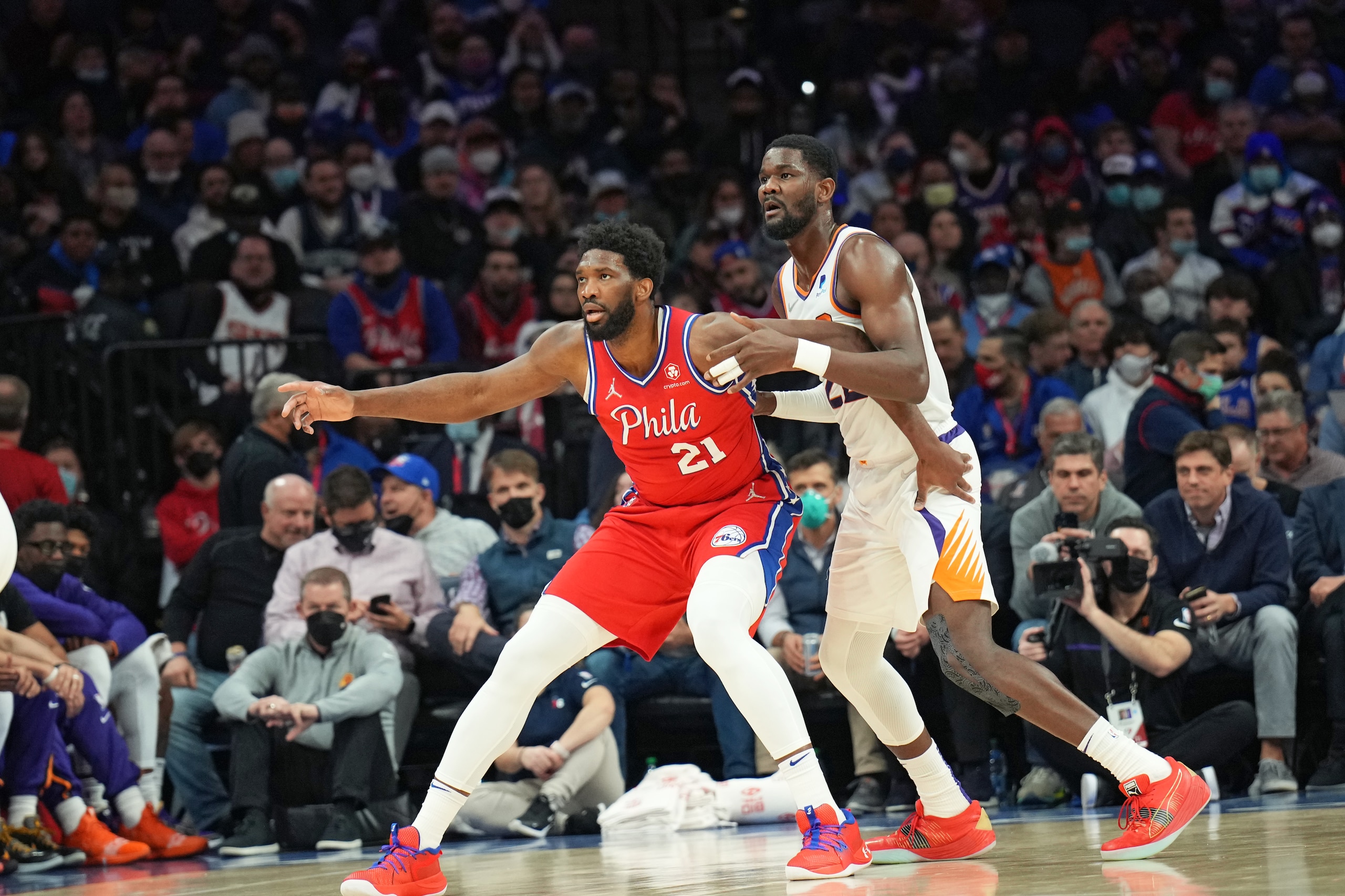 PHILADELPHIA, PA - FEBRUARY 8: Joel Embiid #21 of the Philadelphia 76ers and Deandre Ayton #22 of the Phoenix Suns fight for the position during a game on February 8, 2022 at Wells Fargo Center in Philadelphia, Pennsylvania. NOTE TO USER: User expressly acknowledges and agrees that, by downloading and/or using this Photograph, user is consenting to the terms and conditions of the Getty Images License Agreement. Mandatory Copyright Notice: Copyright 2022 NBAE (Photo by Jesse D. Garrabrant/NBAE via Getty Images)