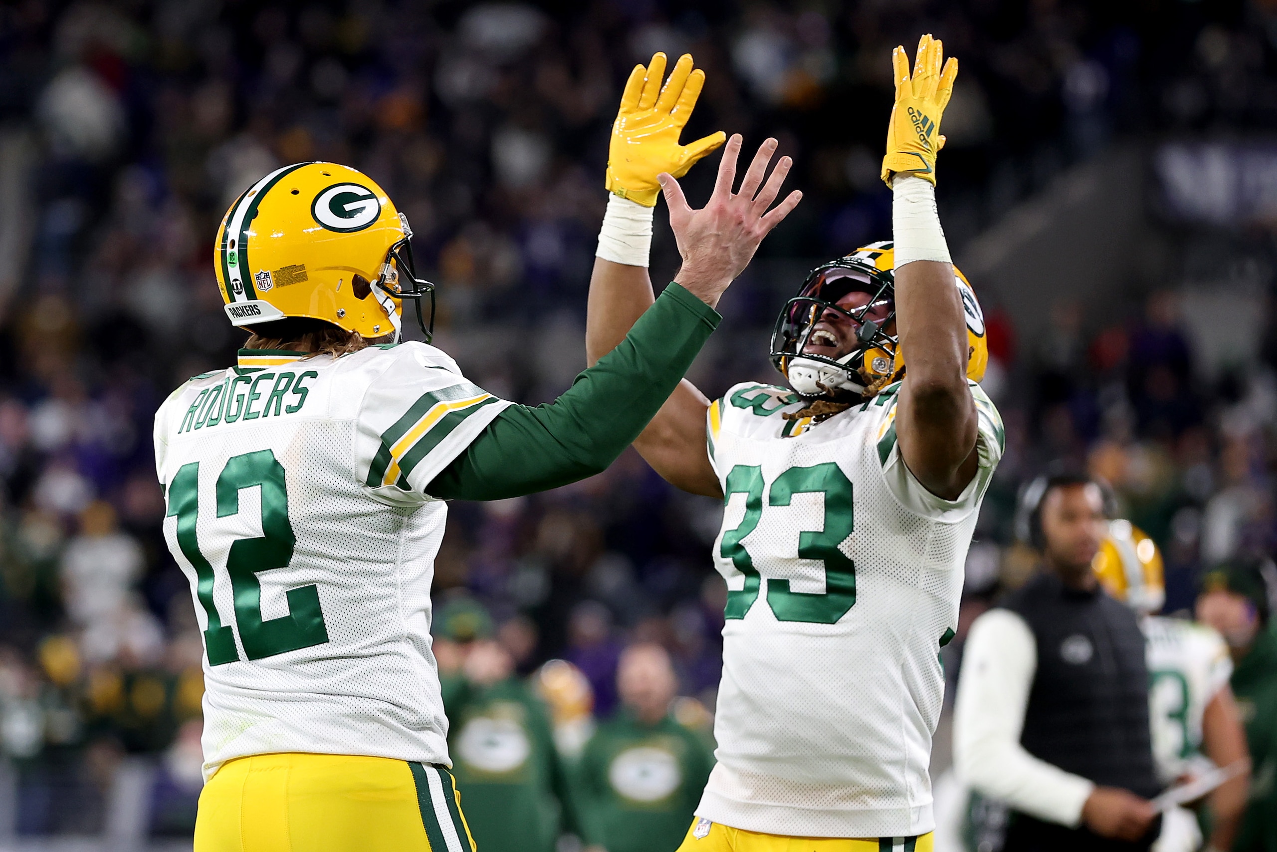 BALTIMORE, MARYLAND - DECEMBER 19: Aaron Rodgers #12 and Aaron Jones #33 of the Green Bay Packers celebrate after Jones' touchdown reception in the third quarter against the Baltimore Ravens at M&T Bank Stadium on December 19, 2021 in Baltimore, Maryland. (Photo by Rob Carr/Getty Images)