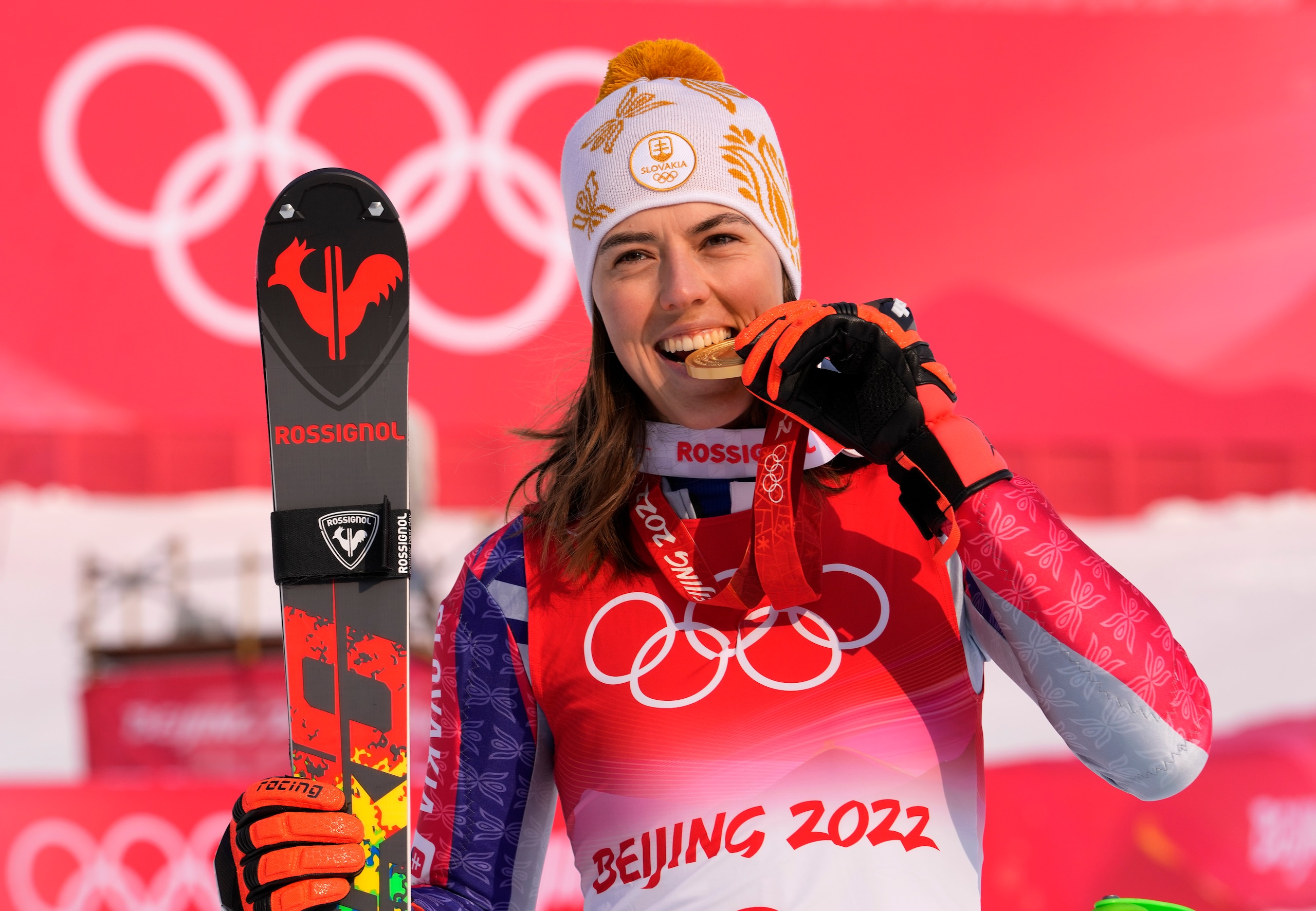 Petra Vlhova, of Slovakia celebrates during the medal ceremony after winning the gold medal in the women's slalom at the 2022 Winter Olympics, Wednesday, Feb. 9, 2022, in the Yanqing district of Beijing. (AP Photo/Luca Bruno)