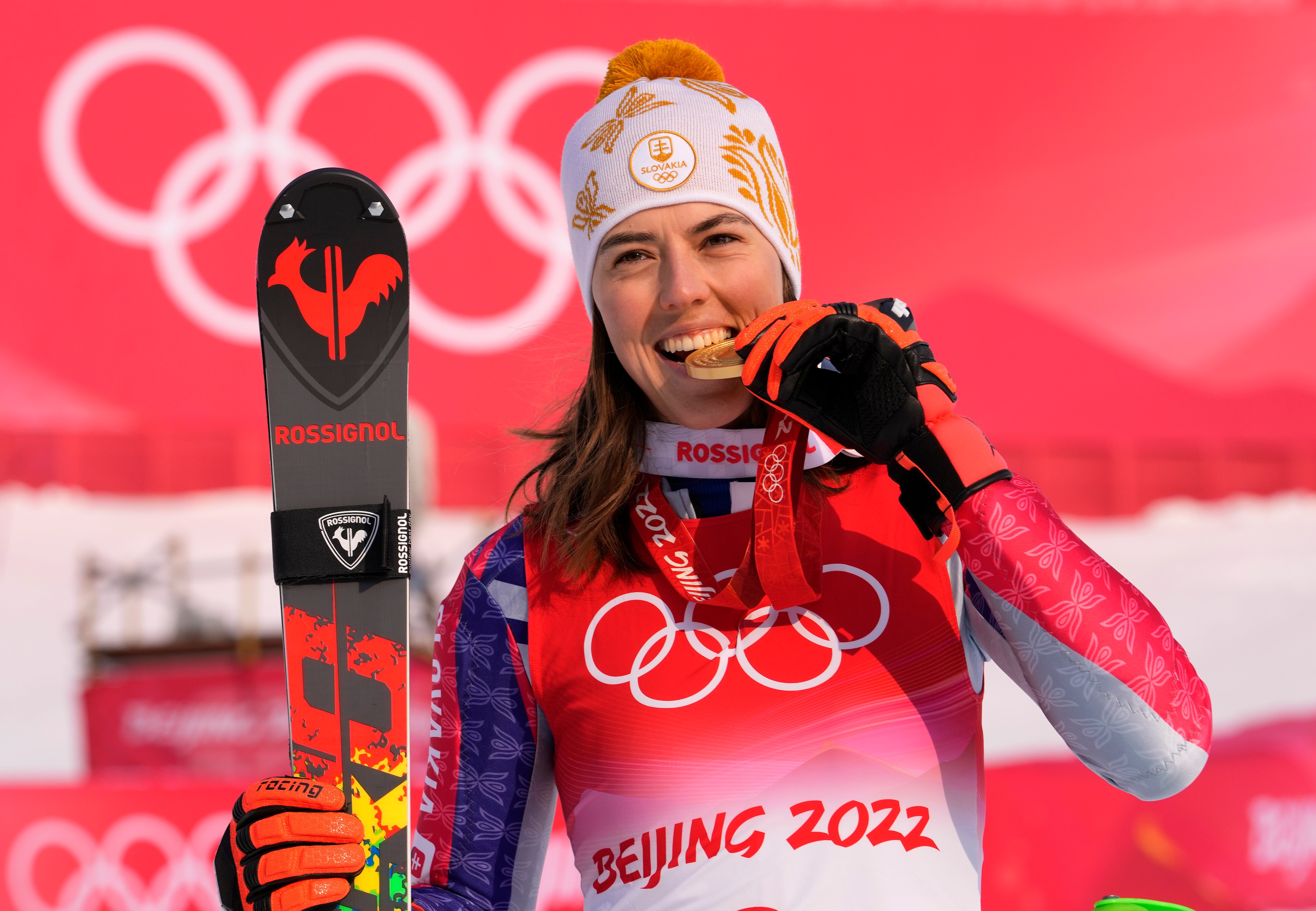 Petra Vlhova, of Slovakia celebrates during the medal ceremony after winning the gold medal in the women's slalom at the 2022 Winter Olympics, Wednesday, Feb. 9, 2022, in the Yanqing district of Beijing. (AP Photo/Luca Bruno)