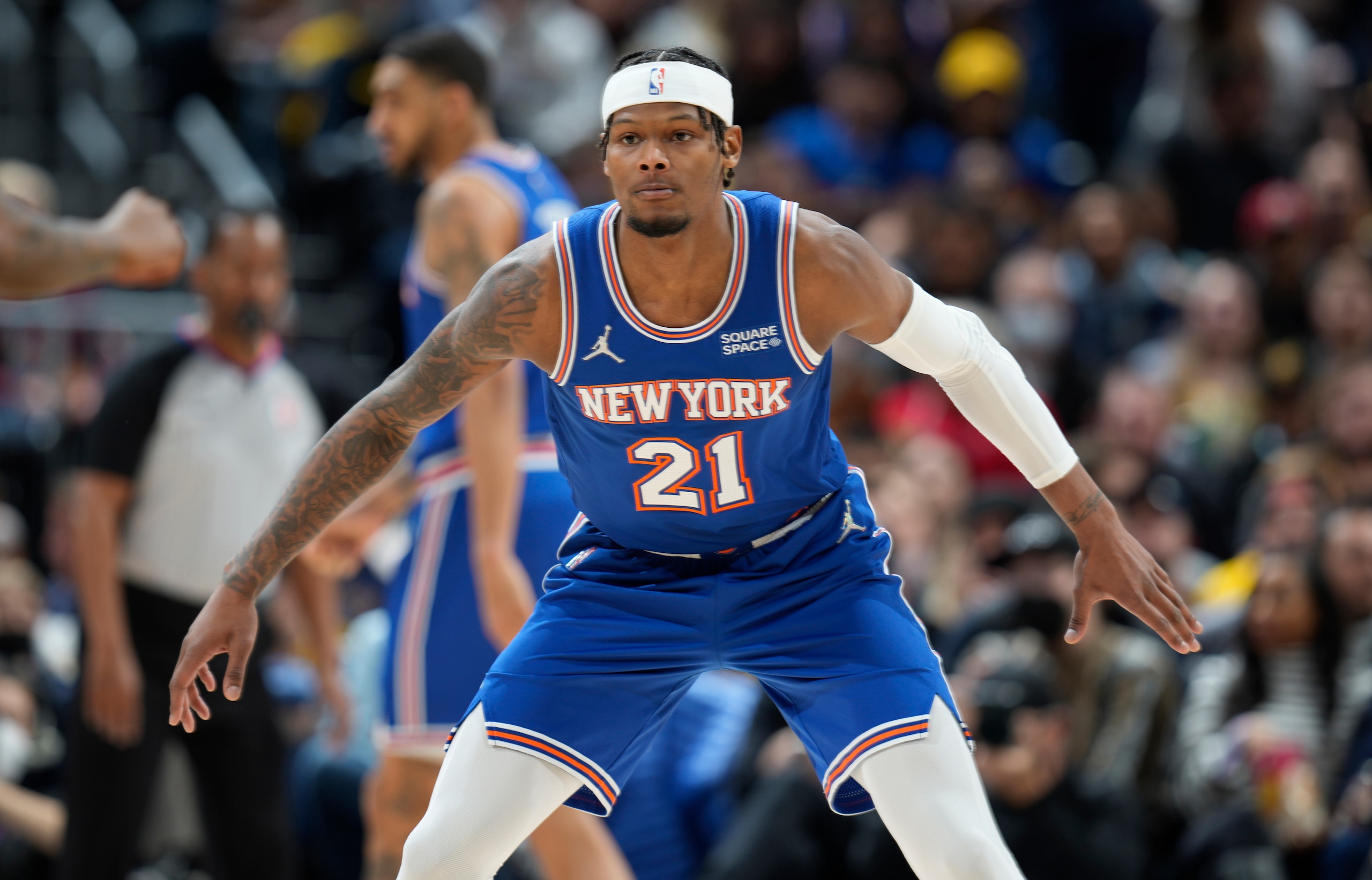 New York Knicks forward Cam Reddish drops back to defend against the Denver Nuggets during the first half of an NBA basketball game Tuesday, Feb. 8, 2022, in Denver. (AP Photo/David Zalubowski)