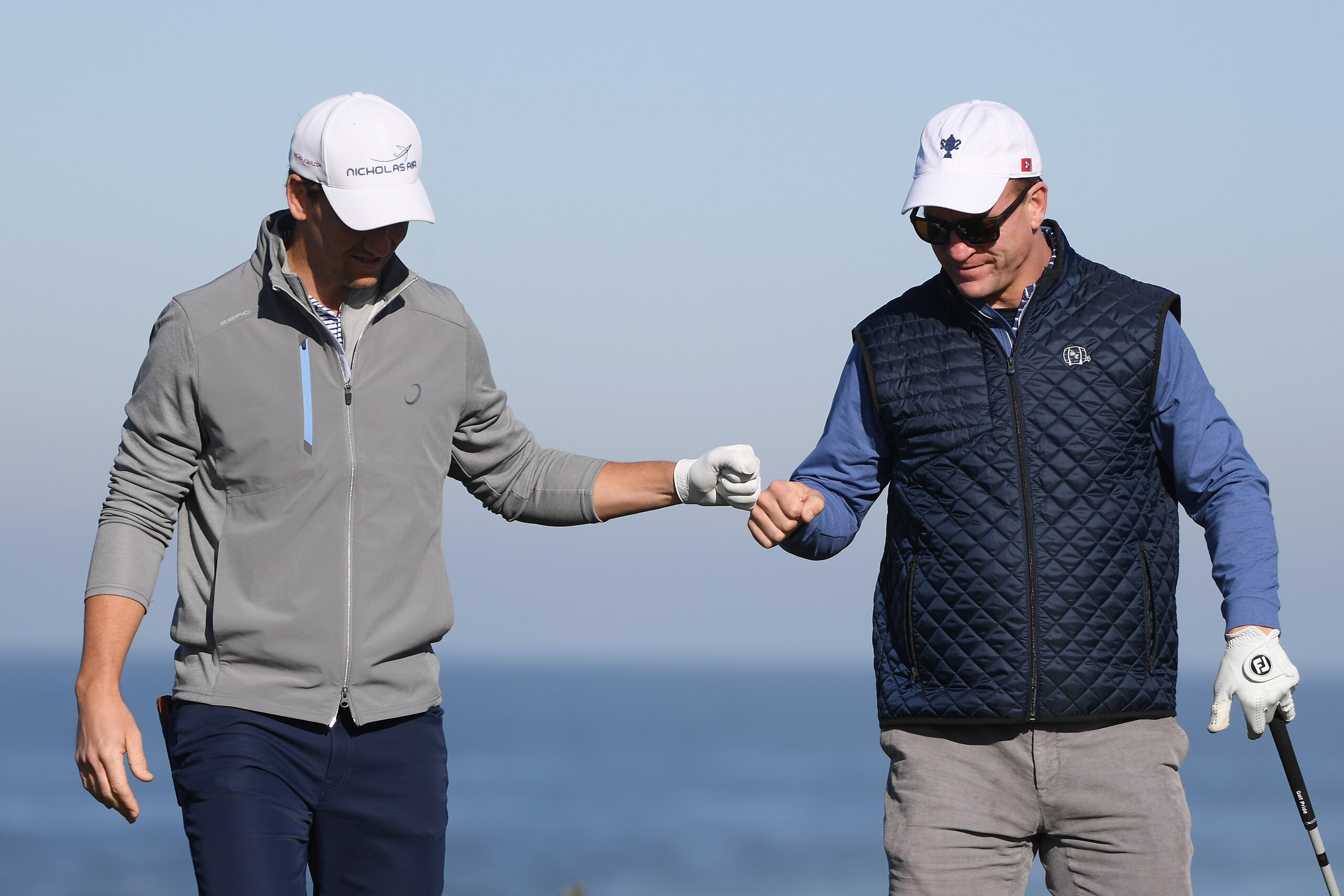 PEBBLE BEACH, CALIFORNIA - FEBRUARY 07:  Former NFL players Eli and Peyton Manning celebrate during the second round of the AT&T Pebble Beach Pro-Am at Monterey Peninsula Country Club on February 07, 2020 in Pebble Beach, California. (Photo by Harry How/Getty Images)