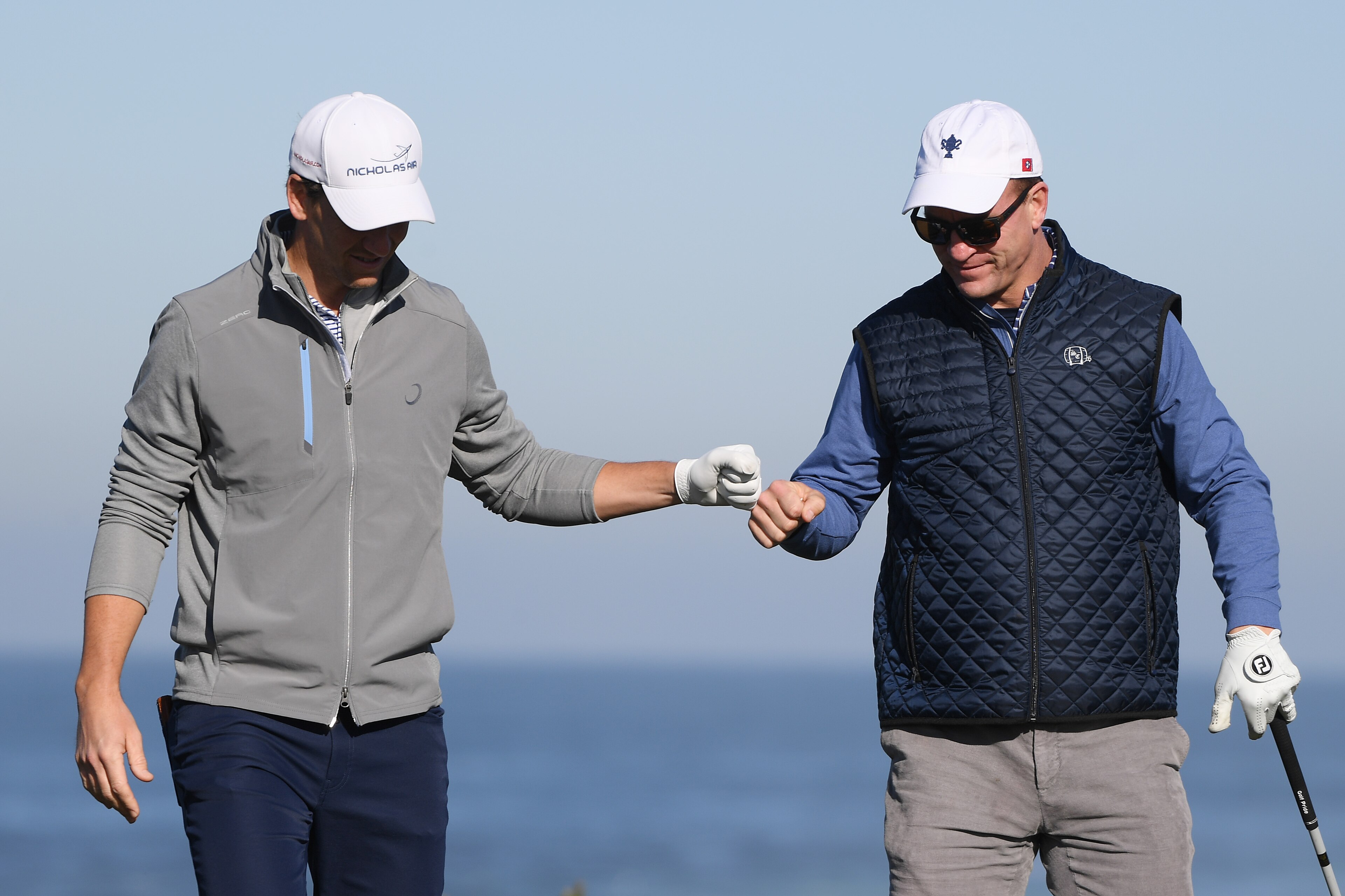 PEBBLE BEACH, CALIFORNIA - FEBRUARY 07:  Former NFL players Eli and Peyton Manning celebrate during the second round of the AT&T Pebble Beach Pro-Am at Monterey Peninsula Country Club on February 07, 2020 in Pebble Beach, California. (Photo by Harry How/Getty Images)