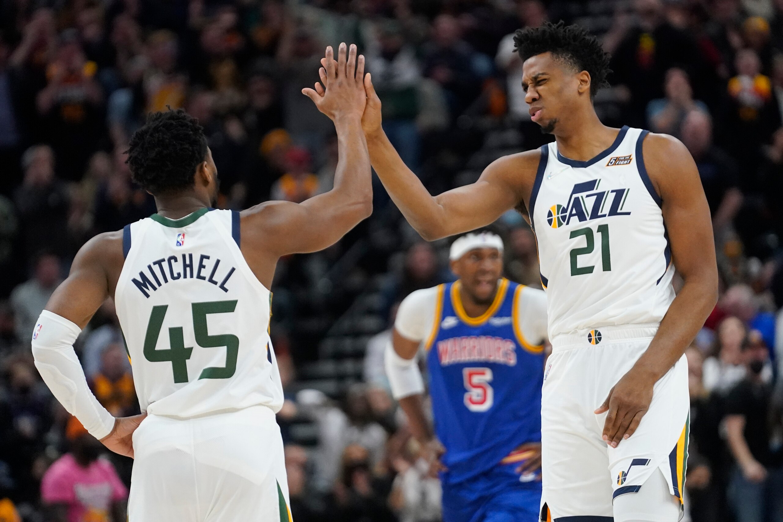 Utah Jazz's Donovan Mitchell (45) and Hassan Whiteside (21) high-five during the first half of the team's NBA basketball game against the Golden State Warriors on Wednesday, Feb. 9, 2022, in Salt Lake City. (AP Photo/Rick Bowmer) Utah Jazz's Donovan Mitchell (45) and Hassan Whiteside (21) high-five during the first half of the team's NBA basketball game against the Golden State Warriors on Wednesday, Feb. 9, 2022, in Salt Lake City. (AP Photo/Rick Bowmer)