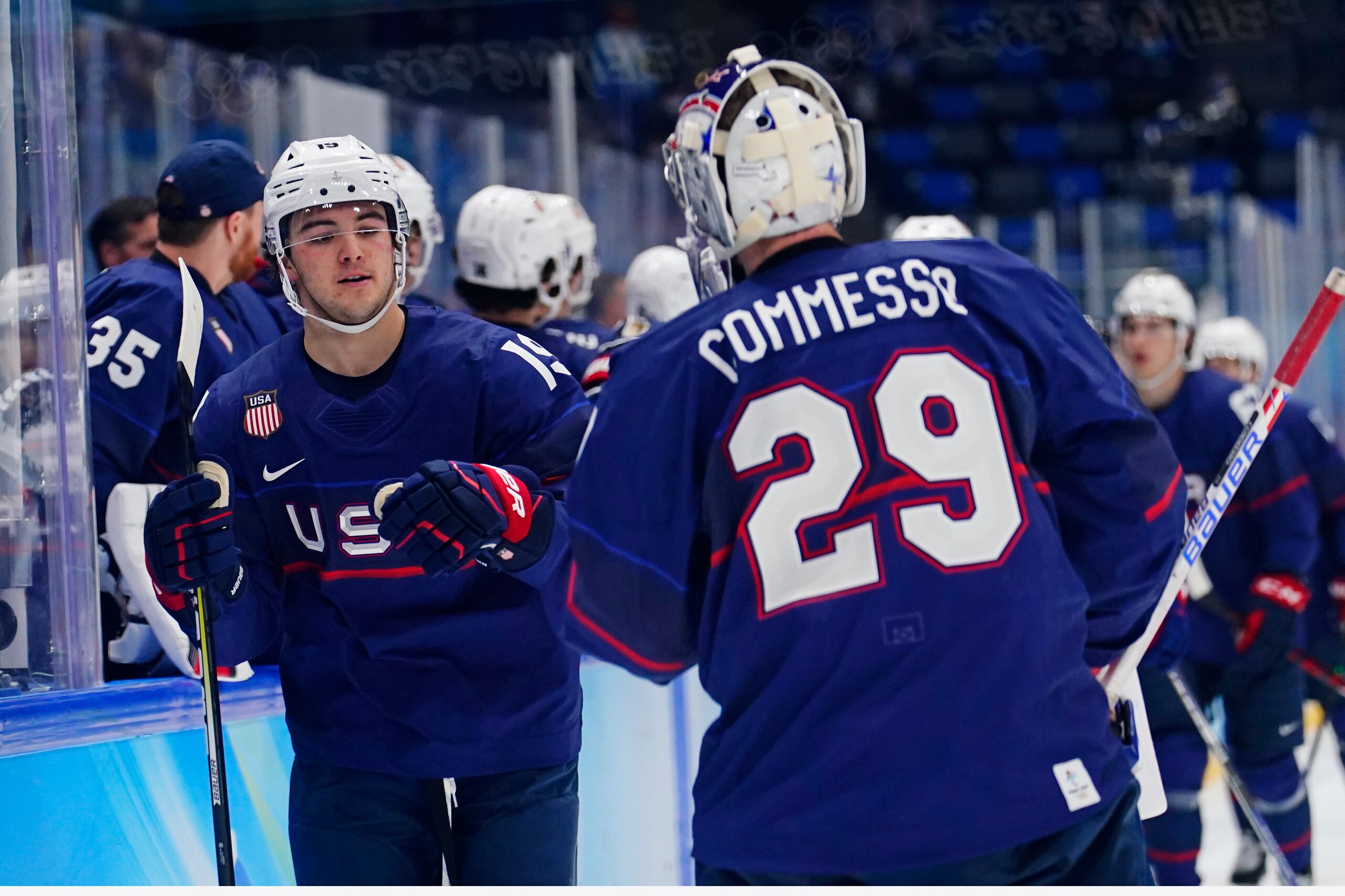 United States' Brendan Brisson (19) is congratulated by Drew Commesso (29) after Brisson scored against China during a preliminary round men's hockey game at the 2022 Winter Olympics, Thursday, Feb. 10, 2022, in Beijing. (AP Photo/Matt Slocum)