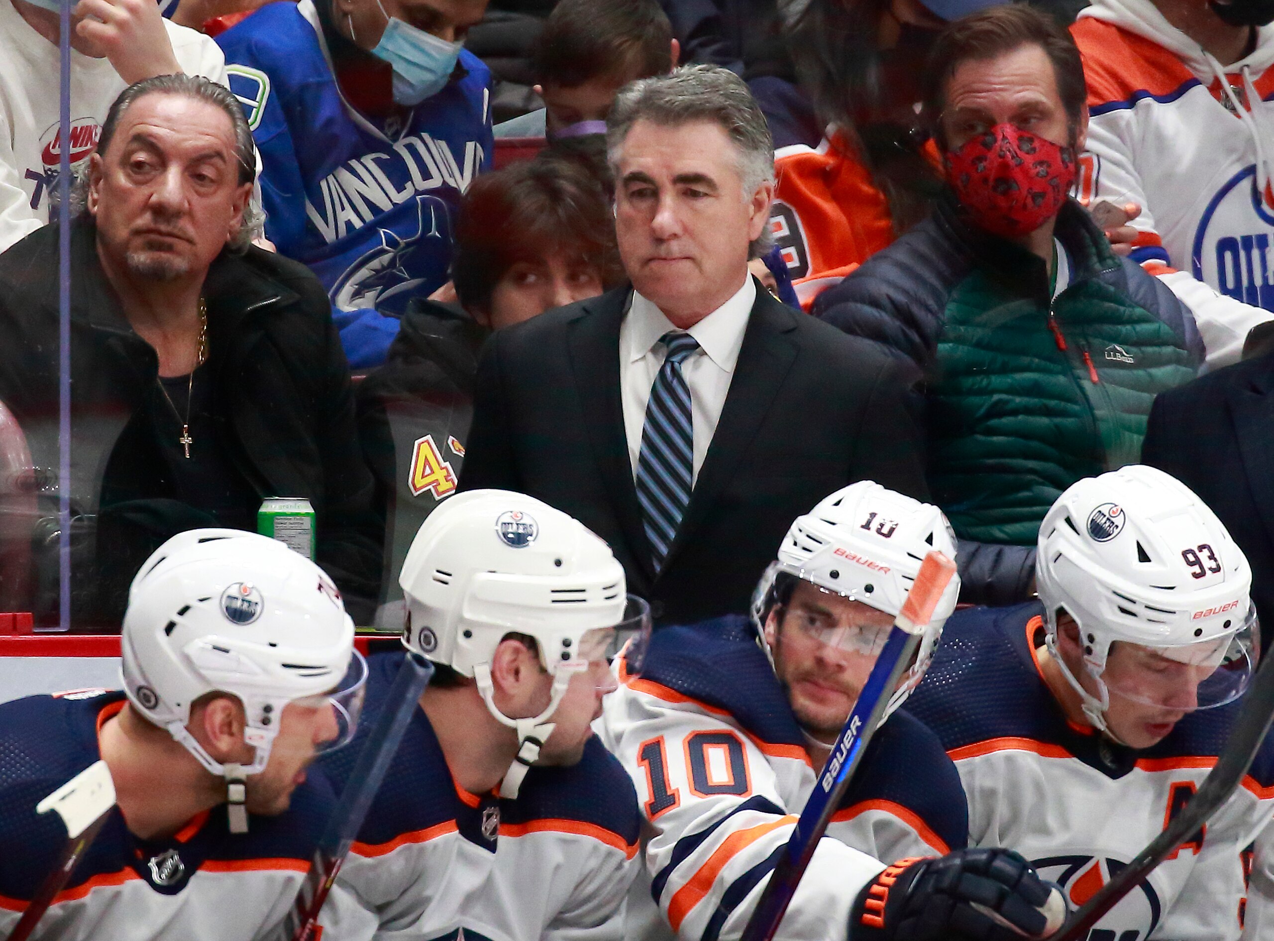 VANCOUVER, BC - JANUARY 25: Head coach Dave Tippett of the Edmonton Oilers looks on from the bench during their NHL game against the Vancouver Canucks at Rogers Arena January 25, 2022 in Vancouver, British Columbia, Canada.  (Photo by Jeff Vinnick/NHLI via Getty Images)"n