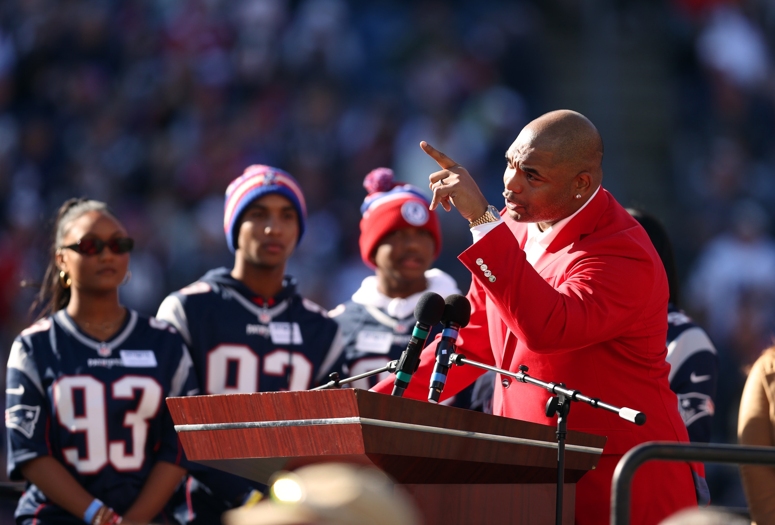 FOXBOROUGH, MASSACHUSETTS - OCTOBER 24: Former defensive tackle Richard Seymour of the New England Patriots at the podium for his hall of fame induction celebration during halftime in the game against the New York Jets at Gillette Stadium on October 24, 2021 in Foxborough, Massachusetts. (Photo by Maddie Meyer/Gages)