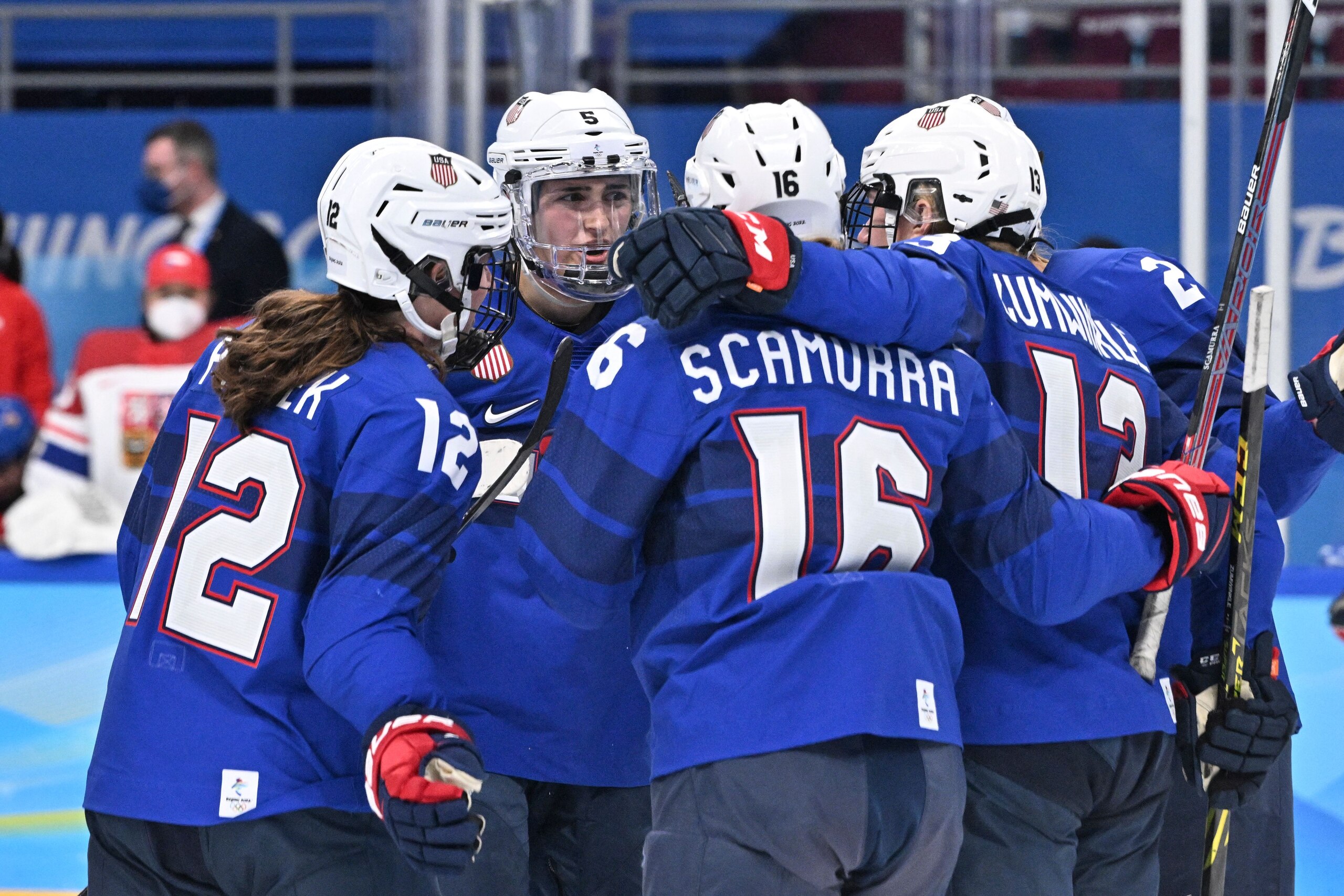 USA's players celebrate after USA's Lee Stecklein scored a goal during the women's play-offs quarterfinals match of the Beijing 2022 Winter Olympic Games ice hockey competition between USA and Czech Republic, at the Wukesong Sports Centre in Beijing on February 11, 2022. (Photo by ANTHONY WALLACE / AFP) (Photo by ANTHONY WALLACE/AFP via Getty Images)