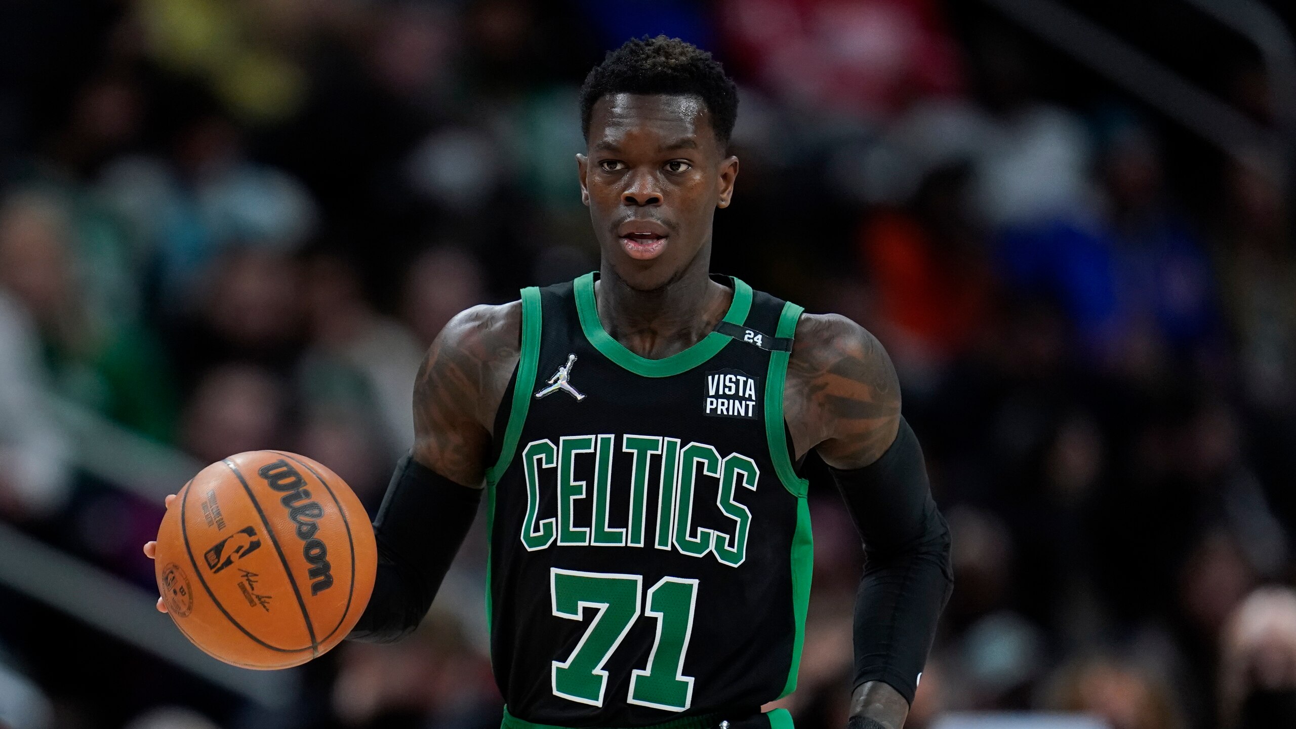 Boston Celtics guard Dennis Schroder plays against the Detroit Pistons in the first half of an NBA basketball game in Detroit, Friday, Feb. 4, 2022. (AP Photo/Paul Sancya)