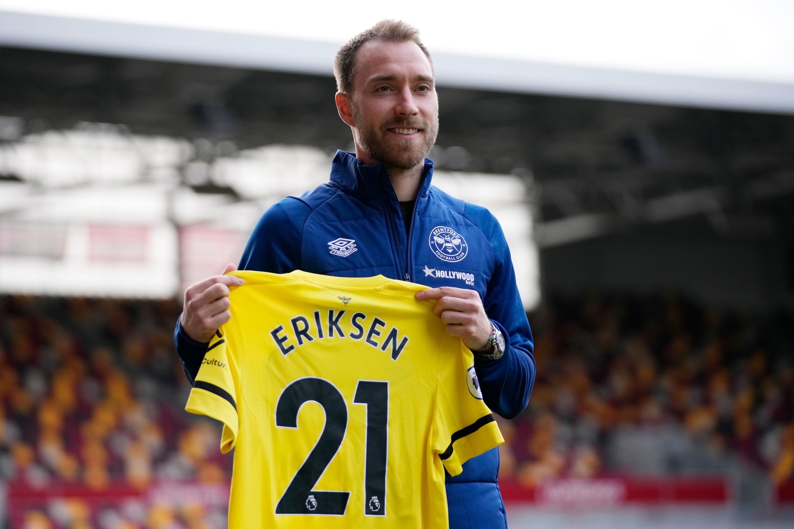 Brentford's newly signed Danish player Christian Eriksen poses for photographs with a team shirt during his official presentation at the Community Stadium, in London, Friday, Feb. 11, 2022. Eriksen has signed with Brentford until the end of the season, almost eight months after collapsing from cardiac arrest at the European Championship. It will be a remarkable playing comeback to the English Premier League for the Denmark playmaker, who has said he was essentially dead for five minutes after collapsing in the opening Euro 2020 game against Finland. (AP Photo/Matt Dunham)