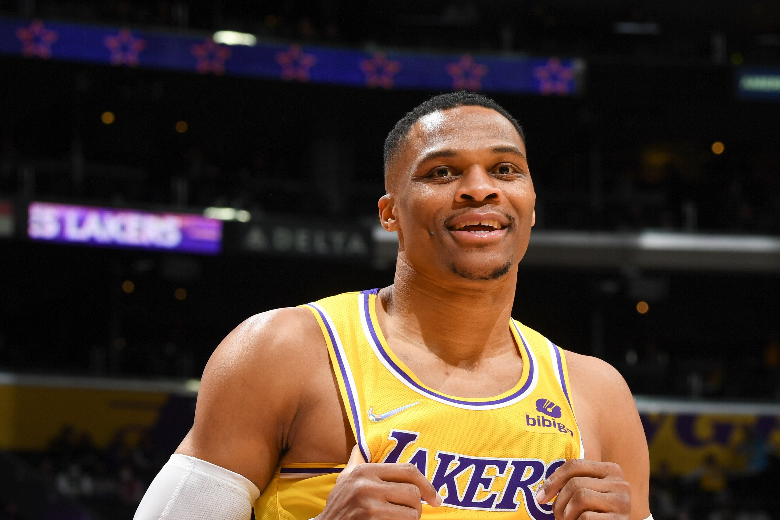 LOS ANGELES, CA - FEBRUARY 8: Russell Westbrook #0 of the Los Angeles Lakers smiles during the game against the Milwaukee Bucks on February 8, 2022 at Crypto.Com Arena in Los Angeles, California. NOTE TO USER: User expressly acknowledges and agrees that, by downloading and/or using this Photograph, user is consenting to the terms and conditions of the Getty Images License Agreement. Mandatory Copyright Notice: Copyright 2022 NBAE (Photo by Andrew D. Bernstein/NBAE via Getty Images)