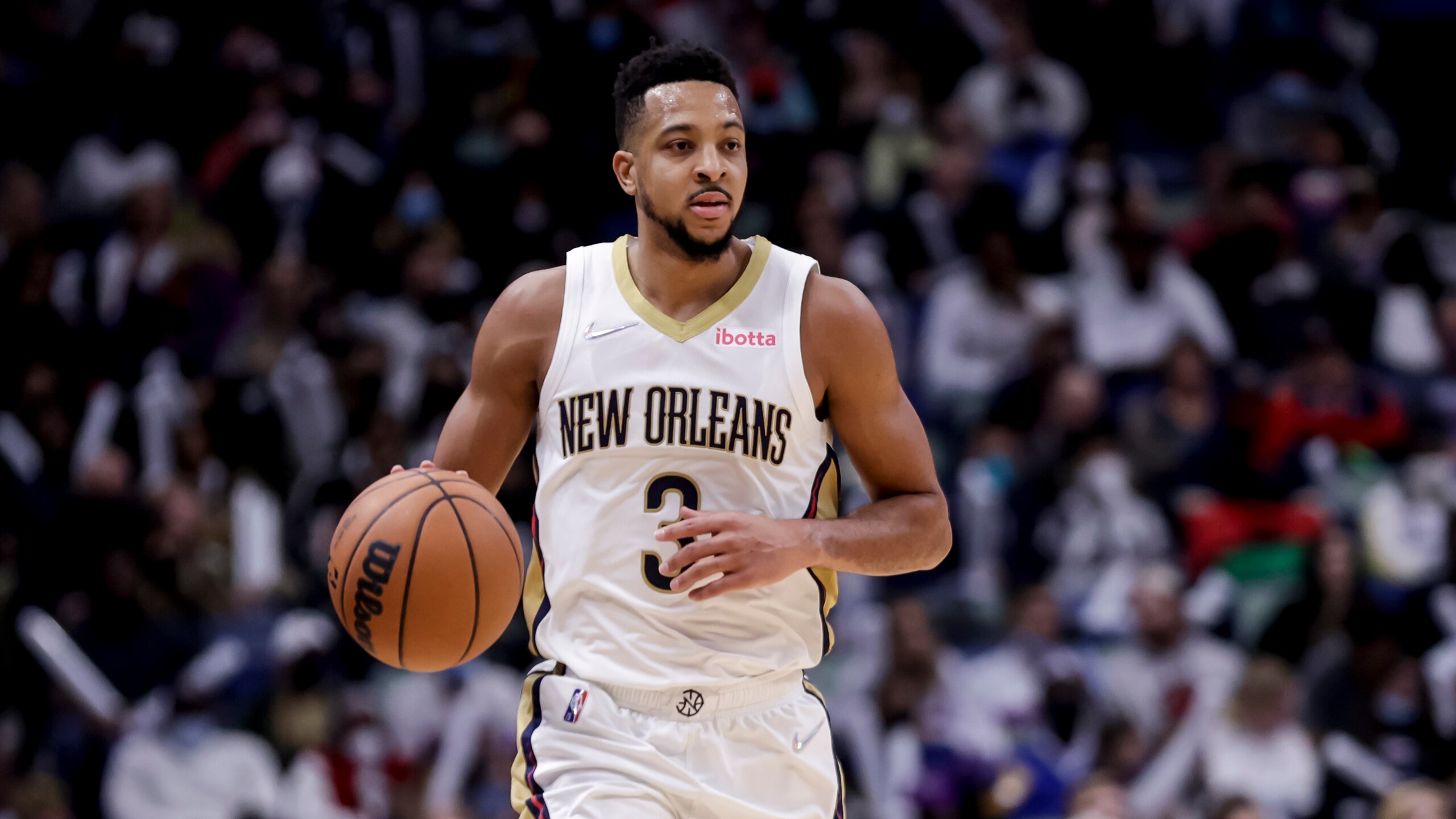 New Orleans Pelicans guard CJ McCollum (3) plays against the Miami Heat in the second half of an NBA basketball game in New Orleans, Thursday, Feb. 10, 2022. (AP Photo/Derick Hingle)