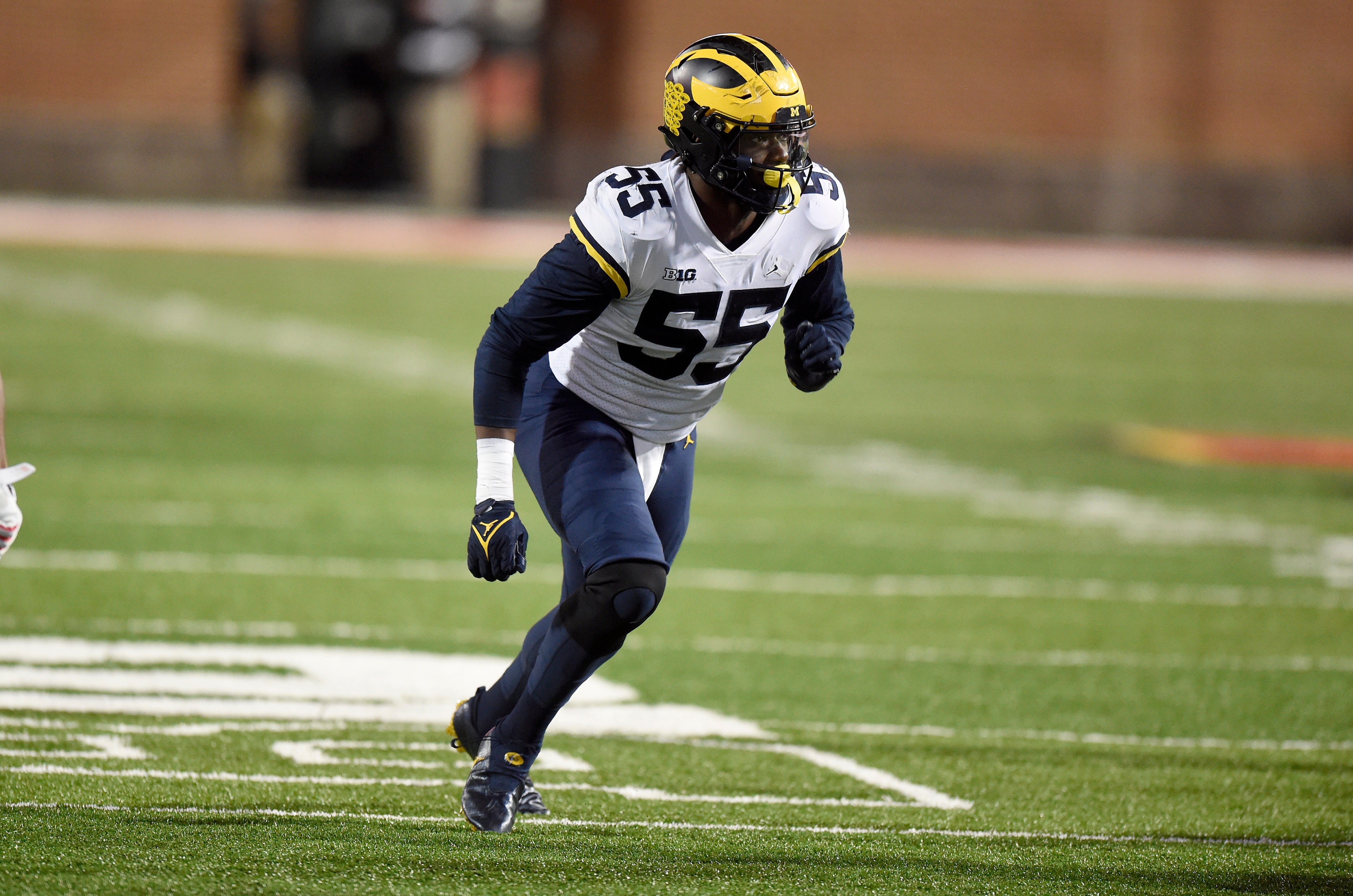 COLLEGE PARK, MARYLAND - NOVEMBER 20: David Ojabo #55 of the Michigan Wolverines defends against the Maryland Terrapins at Capital One Field at Maryland Stadium on November 20, 2021 in College Park, Maryland. (Photo by G Fiume/Getty Images)