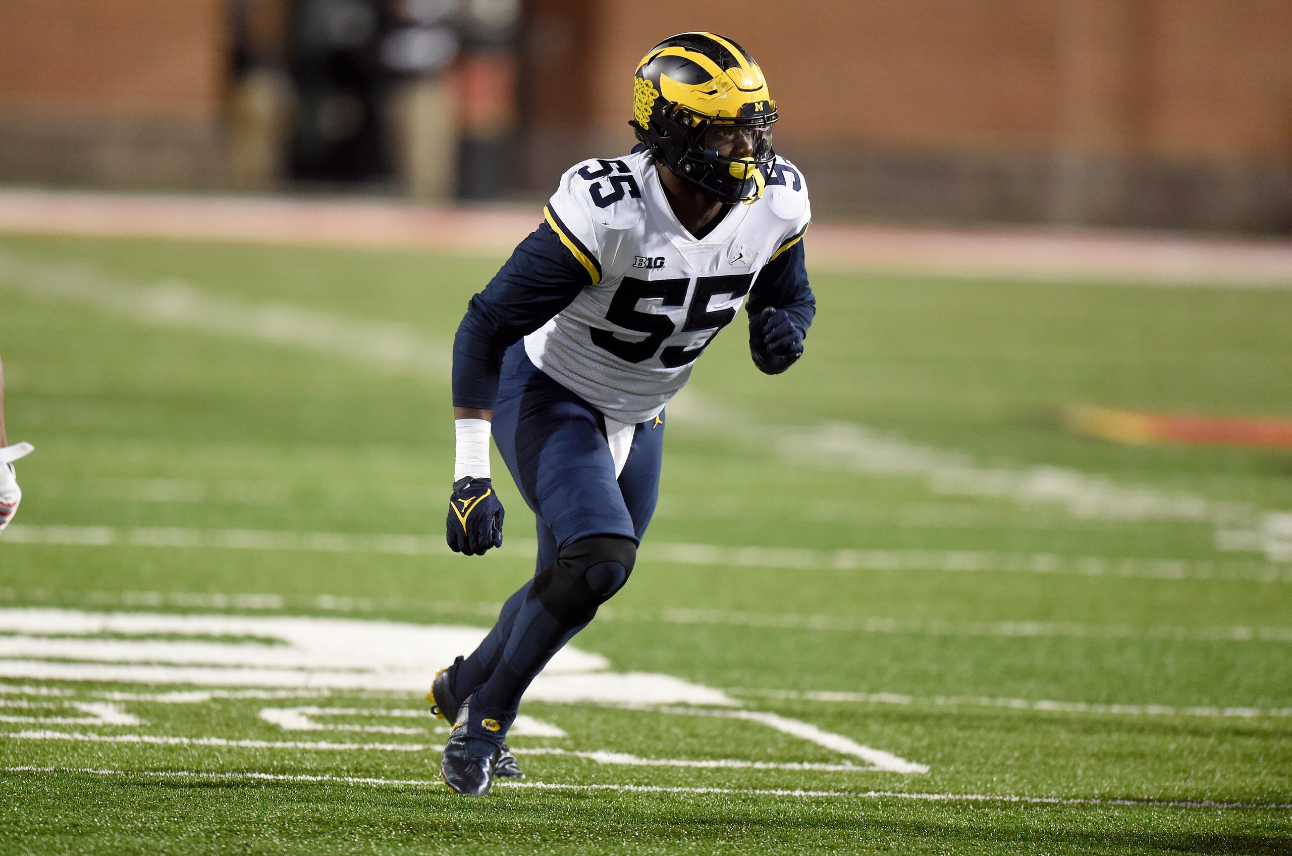 COLLEGE PARK, MARYLAND - NOVEMBER 20: David Ojabo #55 of the Michigan Wolverines defends against the Maryland Terrapins at Capital One Field at Maryland Stadium on November 20, 2021 in College Park, Maryland. (Photo by G Fiume/Getty Images)