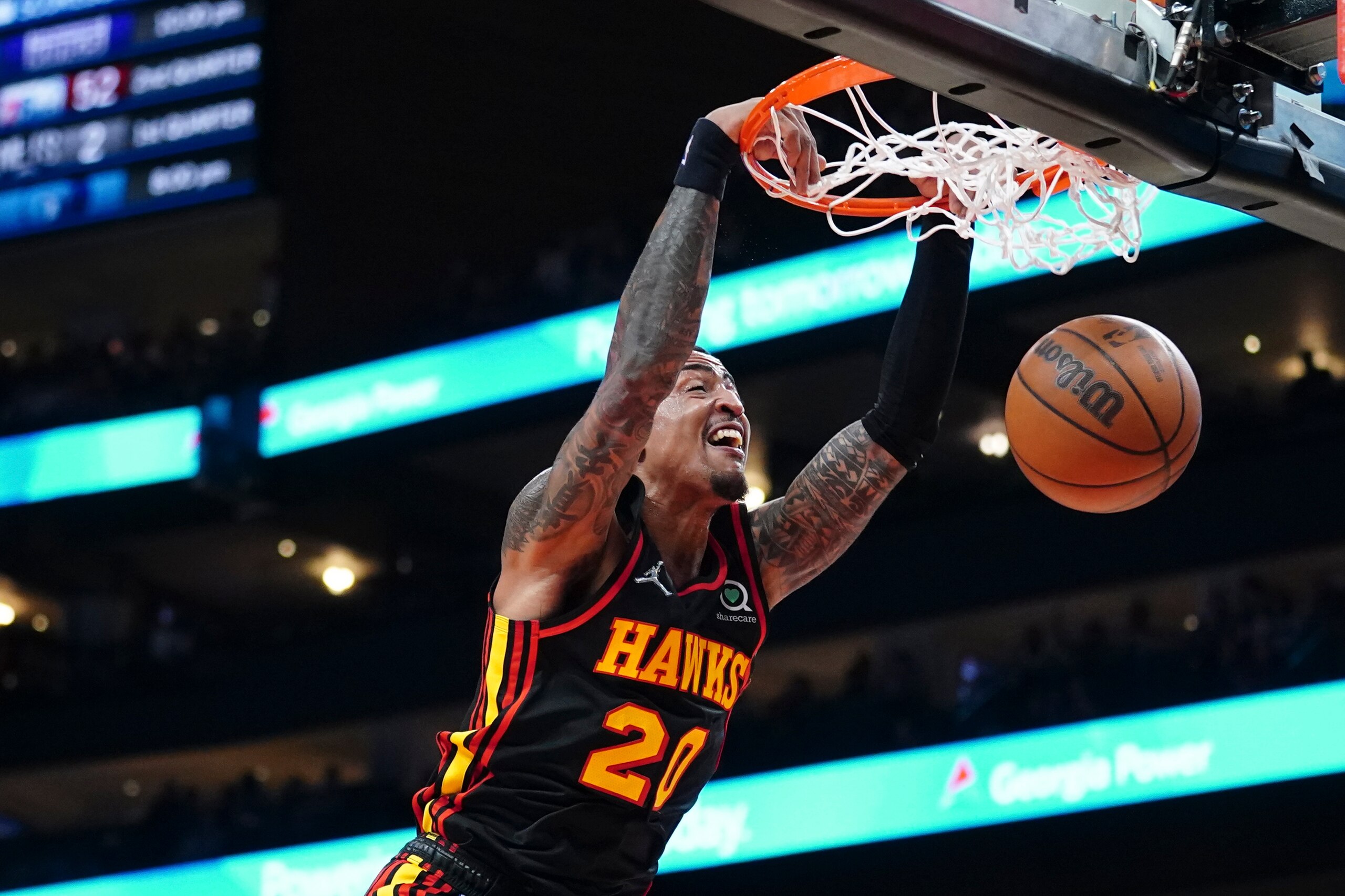 Atlanta Hawks forward John Collins dunks during the first half of the team's NBA basketball game against the Indiana Pacers on Tuesday, Feb. 8, 2022, in Atlanta. (AP Photo/John Bazemore)