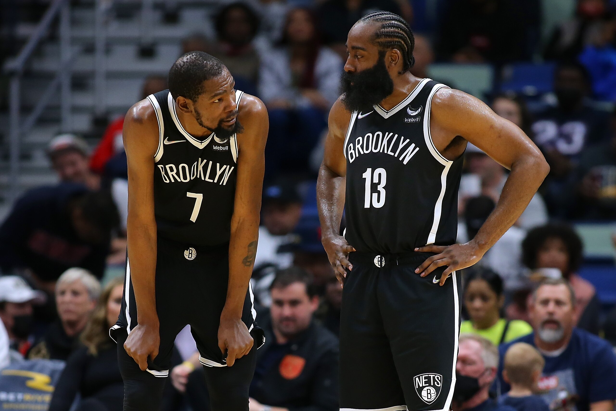 NEW ORLEANS, LOUISIANA - NOVEMBER 12: Kevin Durant #7 and James Harden #13 of the Brooklyn Nets talk during a game against the New Orleans Pelicans at the Smoothie King Center on November 12, 2021 in New Orleans, Louisiana. NOTE TO USER: User expressly acknowledges and agrees that, by downloading and or using this Photograph, user is consenting to the terms and conditions of the Getty Images License Agreement. (Photo by Jonathan Bachman/Getty Images)