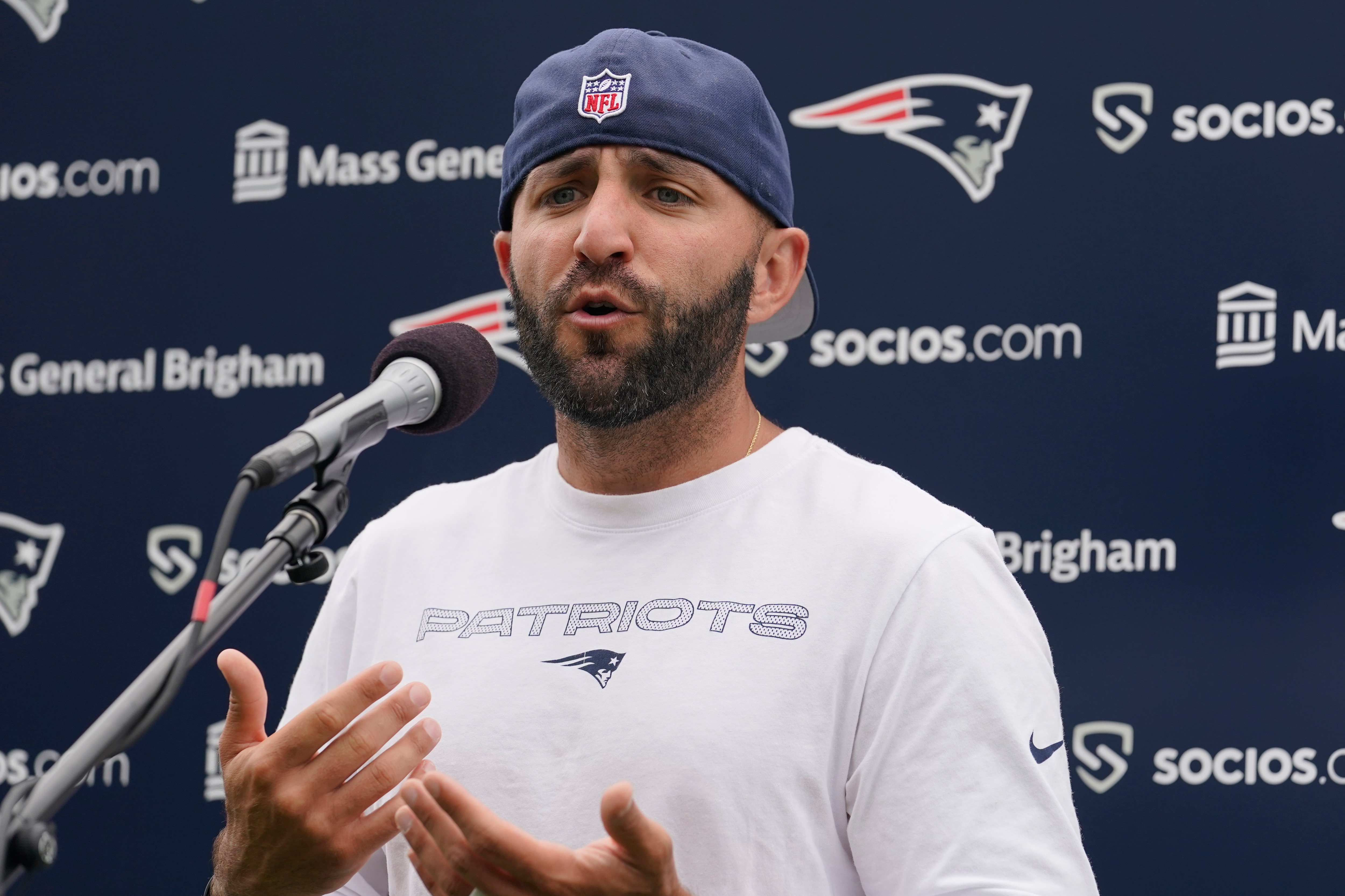 New England Patriots receivers coach Mick Lombardi faces reporters following an NFL football practice, Wednesday, Aug. 4, 2021, in Foxborough, Mass. (AP Photo/Steven Senne)