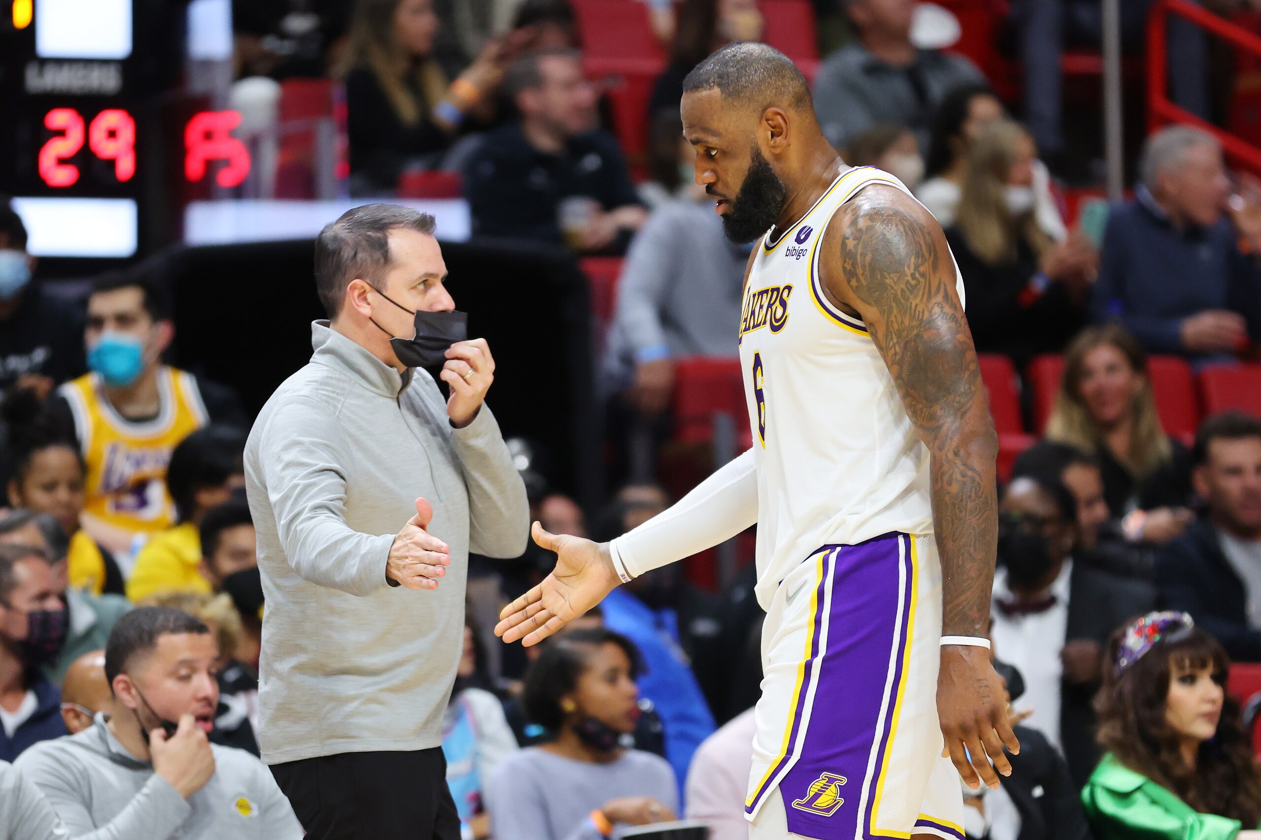 MIAMI, FLORIDA - JANUARY 23: LeBron James #6 of the Los Angeles Lakers high fives head coach Frank Vogel against the Miami Heat at FTX Arena on January 23, 2022 in Miami, Florida. NOTE TO USER: User expressly acknowledges and agrees that, by downloading and or using this photograph, User is consenting to the terms and conditions of the Getty Images License Agreement.  (Photo by Michael Reaves/Getty Images)