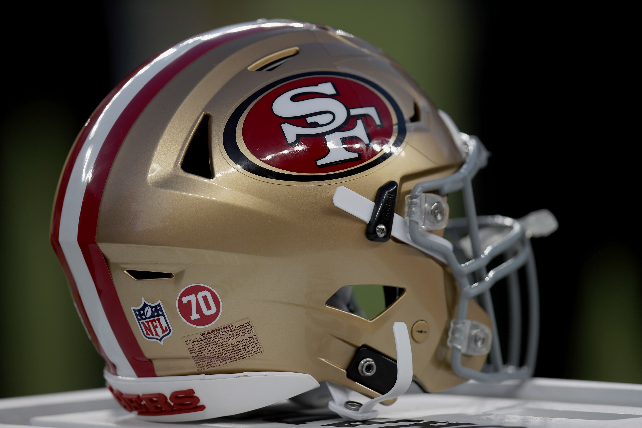 A San Francisco 49ers helmet sits on the sideline during an NFL football game against the Kansas City Chiefs, Saturday, Aug. 14, 2021, in Santa Clara, Calif. (AP Photo/Scot Tucker)