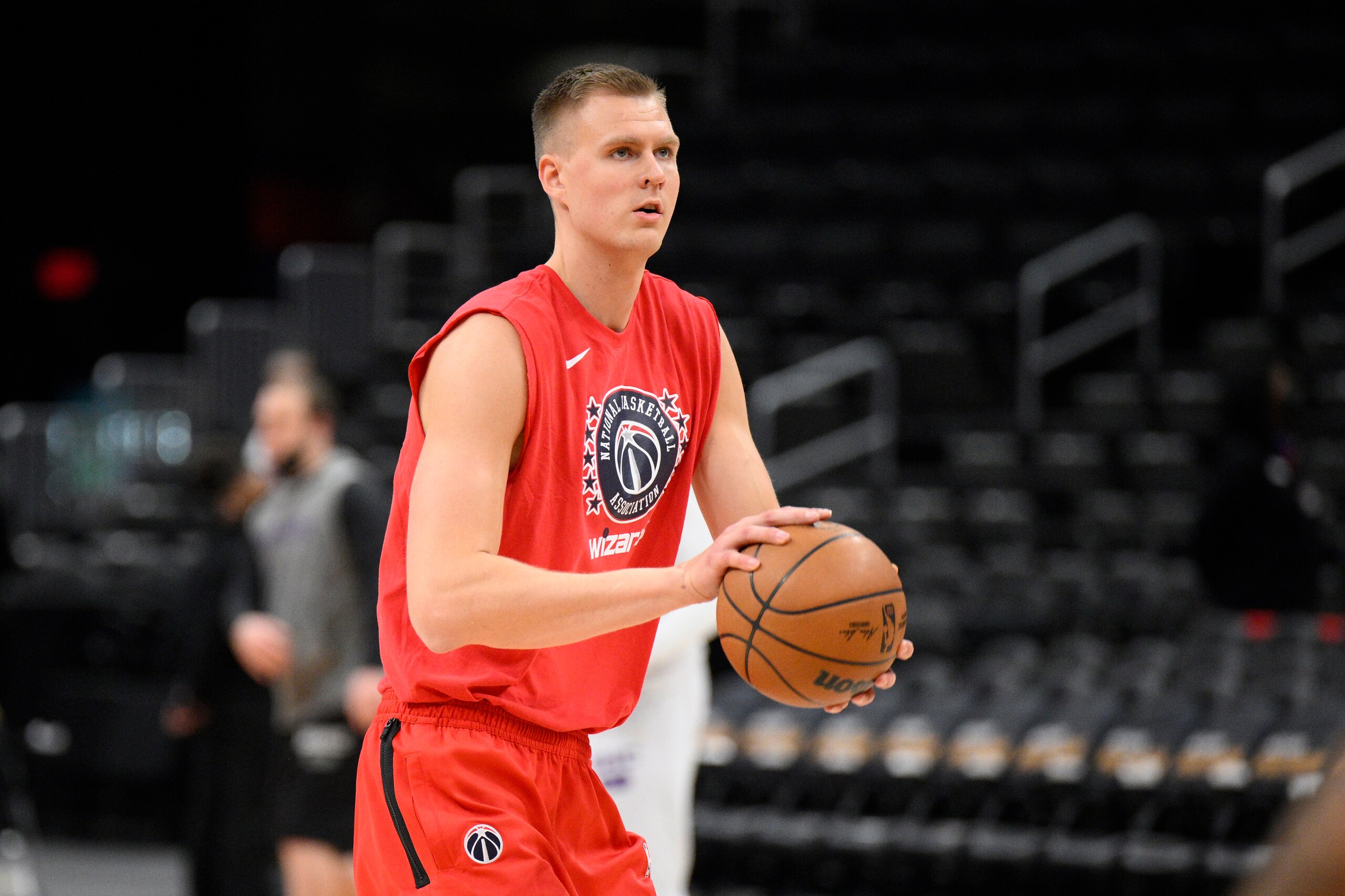 Washington Wizards center Kristaps Porzingis works out before an NBA basketball game against the Sacramento Kings, Saturday, Feb. 12, 2022, in Washington. (AP Photo/Nick Wass)