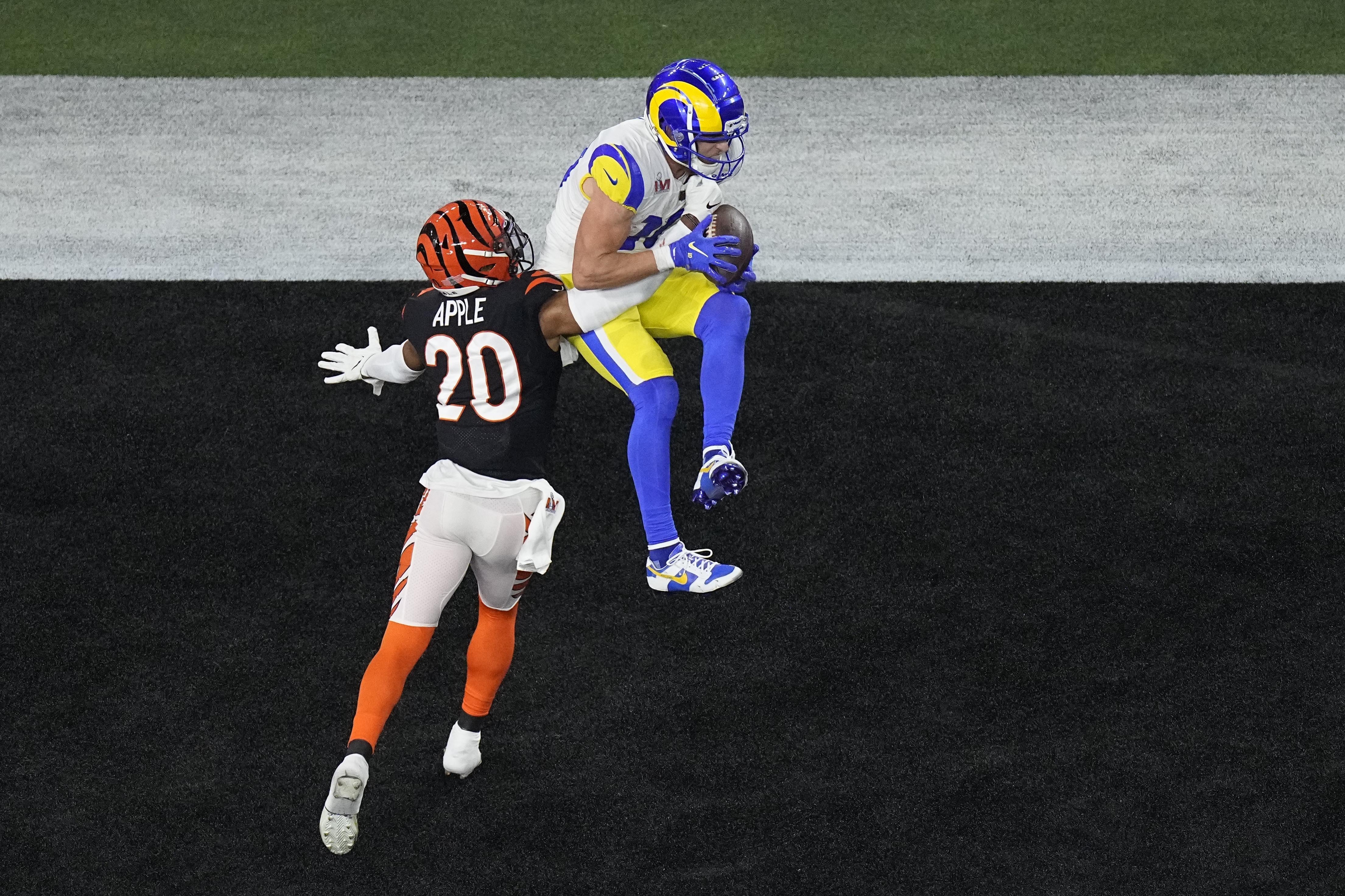 Los Angeles Rams wide receiver Cooper Kupp (10) grabs a touchdown pass as Cincinnati Bengals cornerback Eli Apple (20) makes the tackle during the second half of the NFL Super Bowl 56 football game, Sunday, Feb. 13, 2022, in Inglewood, Calif. (AP Photo/Matt Rourke)