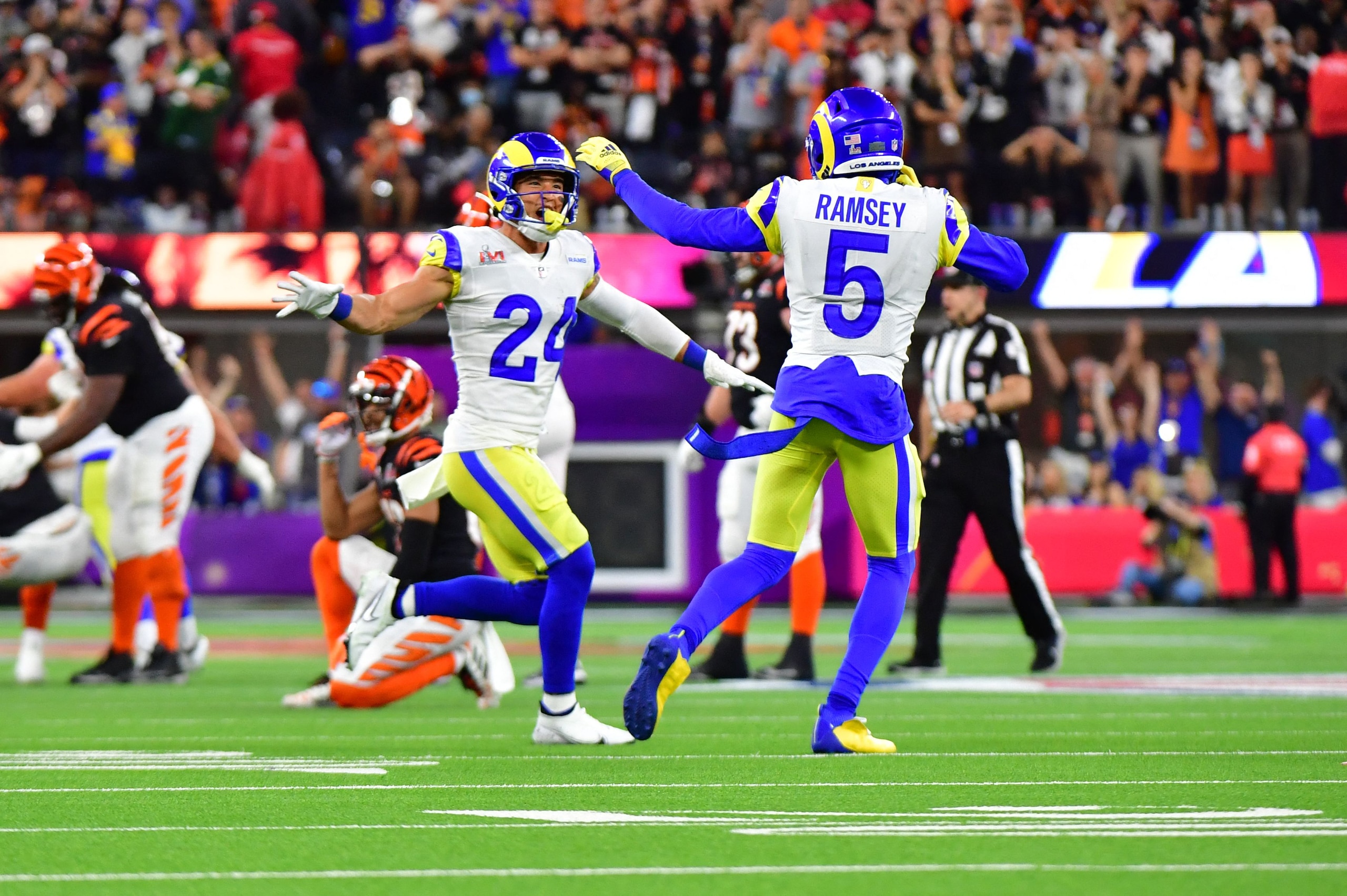 Los Angeles Rams' Taylor Rapp (L) and Los Angeles Rams' Jalen Ramsey celebrate after winning Super Bowl LVI between the Los Angeles Rams and the Cincinnati Bengals at SoFi Stadium in Inglewood, California, on February 13, 2022. (Photo by Frederic J. Brown / AFP) (Photo by FREDERIC J. BROWN/AFP via Getty Images)