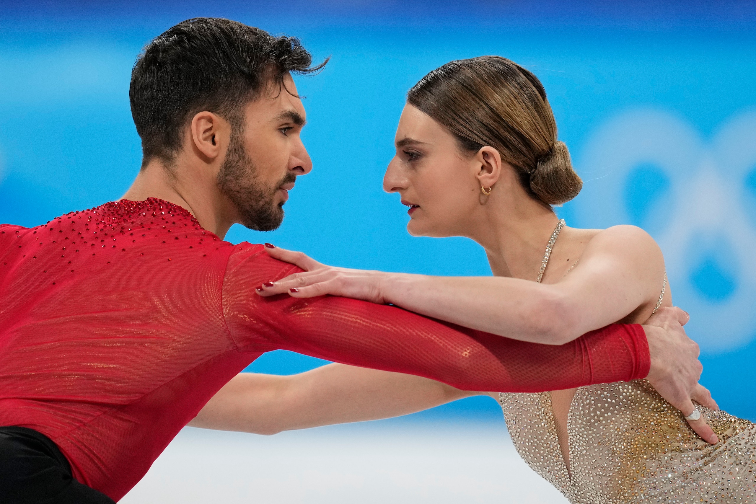 Gabriella Papadakis and Guillaume Cizeron, of France, perform their routine in the ice dance competition during the figure skating at the 2022 Winter Olympics, Monday, Feb. 14, 2022, in Beijing. (AP Photo/Bernat Armangue)