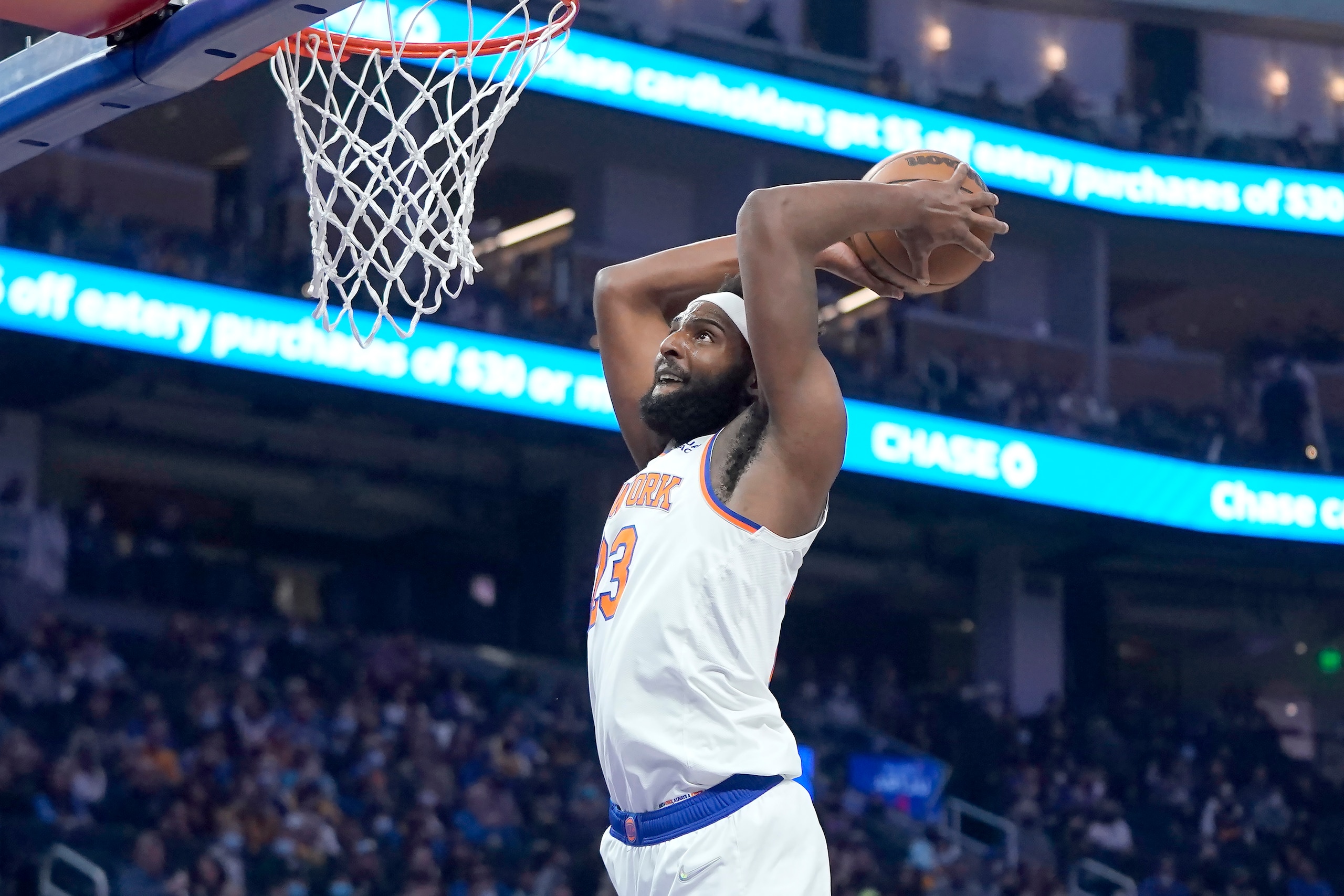 New York Knicks center Mitchell Robinson (23) dunks against the Golden State Warriors during the first half of an NBA basketball game in San Francisco, Thursday, Feb. 10, 2022. (AP Photo/Jeff Chiu)