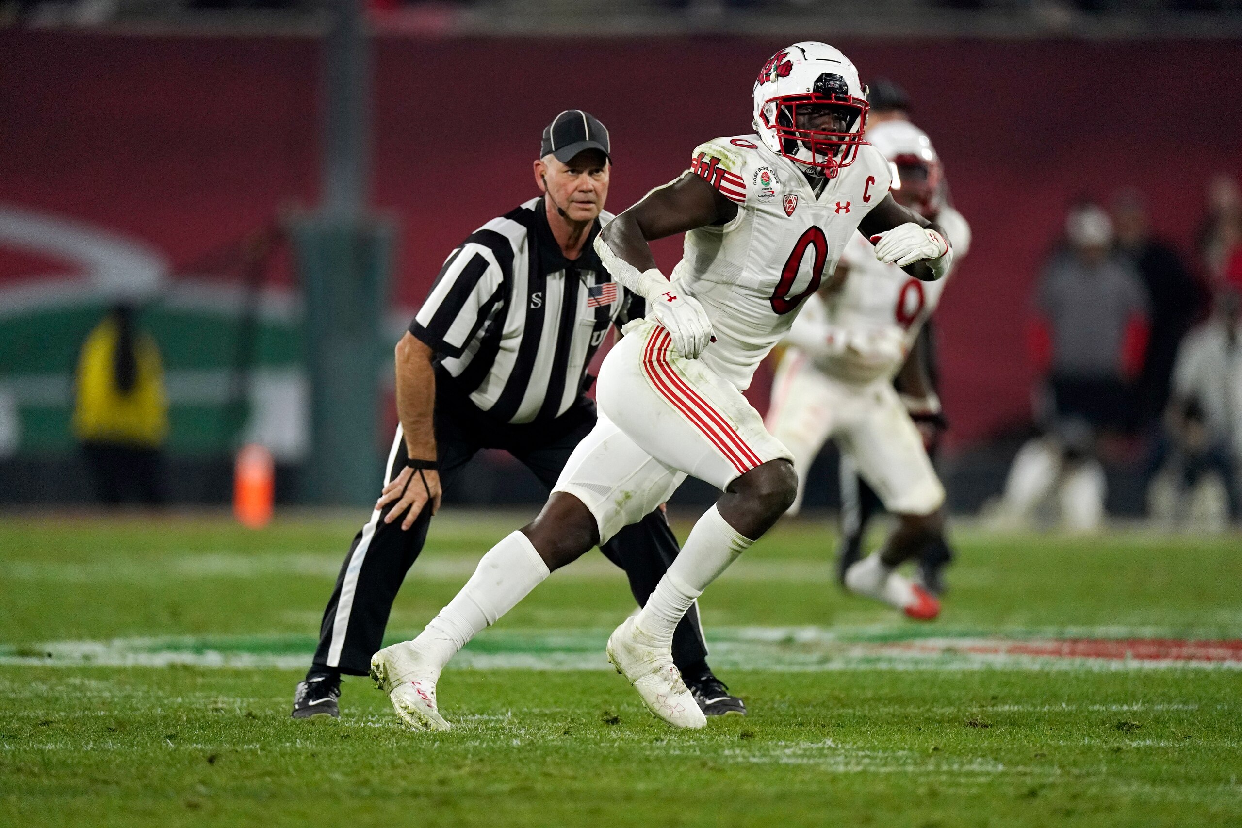 Utah linebacker Devin Lloyd (0) defends during the second half in the Rose Bowl NCAA college football game against Ohio State Saturday, Jan. 1, 2022, in Pasadena, Calif. (AP Photo/Mark J. Terrill)