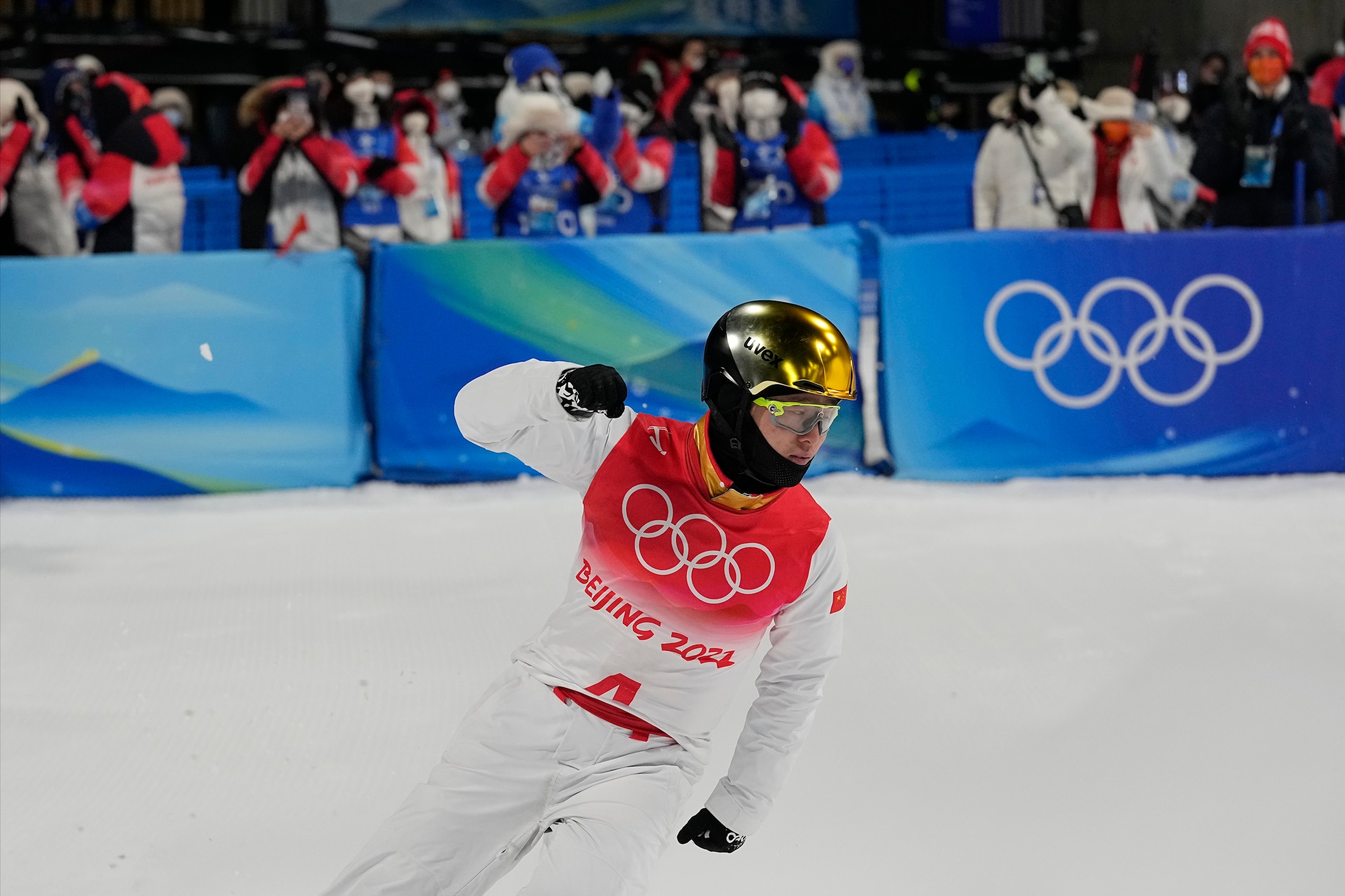 China's Qi Guangpu reacts during the men's aerials finals at the 2022 Winter Olympics, Wednesday, Feb. 16, 2022, in Zhangjiakou, China. (AP Photo/Gregory Bull)