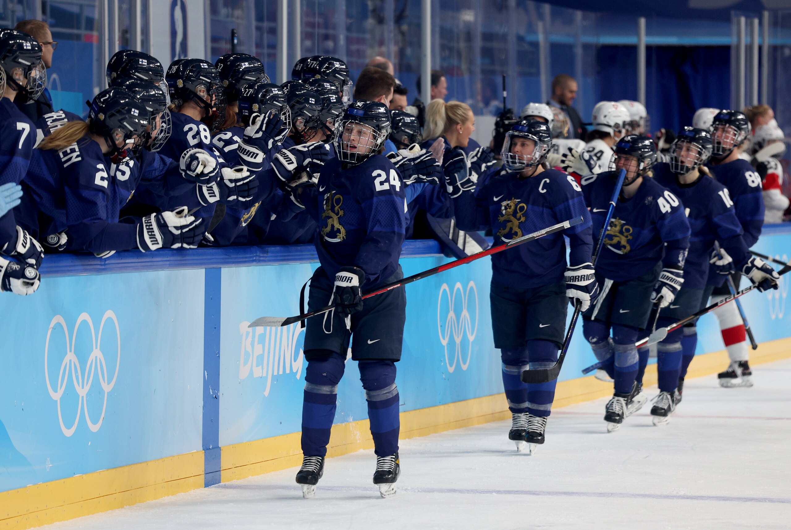 BEIJING, CHINA - FEBRUARY 16: Viivi Vainikka #24 of Team Finland celebrate with team mates after scoring the opening goal in the first period during the Women’s Ice Hockey Bronze medal match between Team Finland and Team Switzerland on Day 12 of the Beijing 2022 Winter Olympic Games at Wukesong Sports Centre on February 16, 2022 in Beijing, China. (Photo by Harry How/Getty Images)