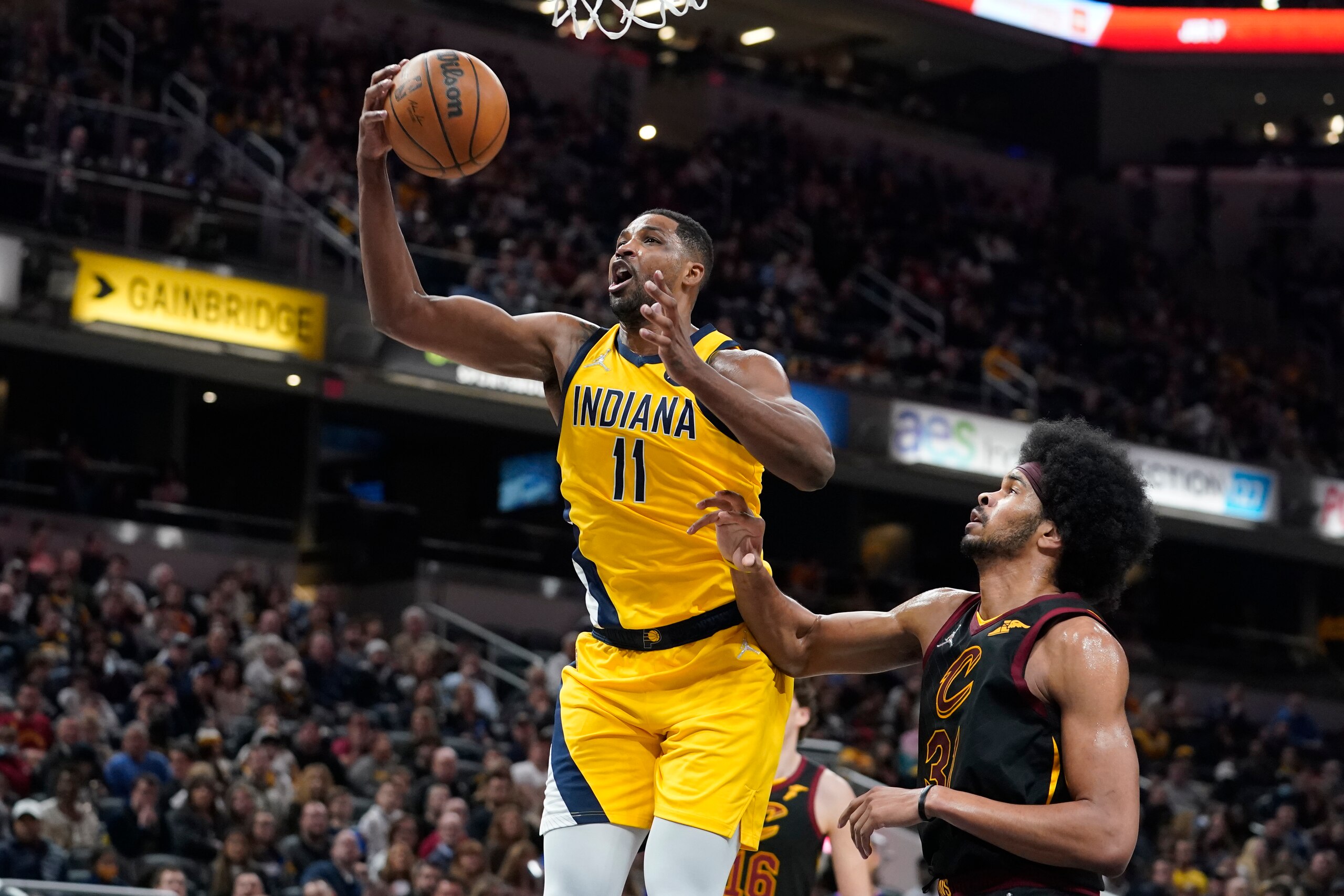 Indiana Pacers' Tristan Thompson (11) grabs a rebound next to Cleveland Cavaliers' Jarrett Allen (31) during the second half of an NBA basketball game Friday, Feb. 11, 2022, in Indianapolis. The Cavaliers won 120-113. (AP Photo/Darron Cummings) Indiana Pacers' Tristan Thompson (11) grabs a rebound next to Cleveland Cavaliers' Jarrett Allen (31) during the second half of an NBA basketball game Friday, Feb. 11, 2022, in Indianapolis. The Cavaliers won 120-113. (AP Photo/Darron Cummings)