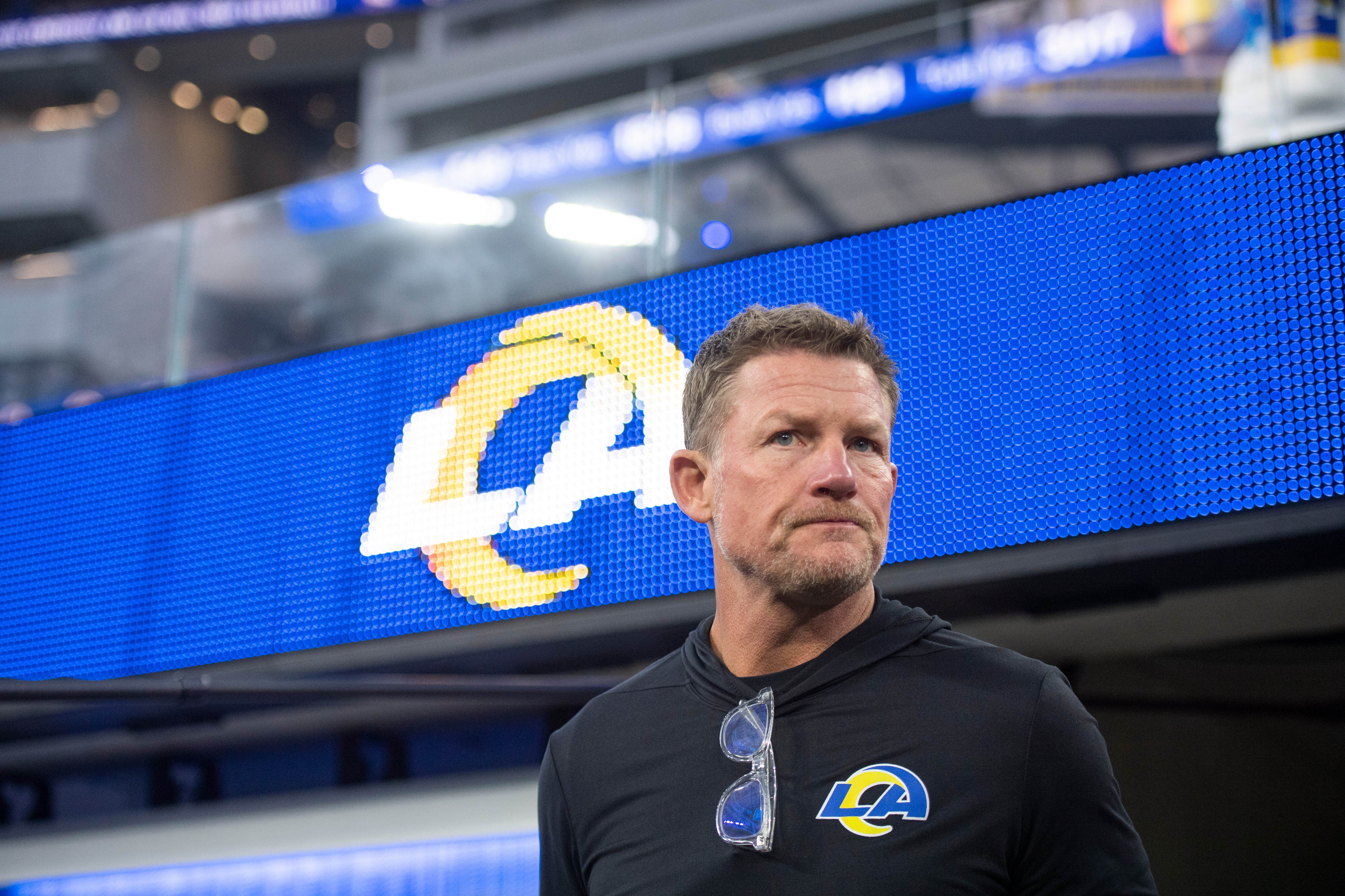 Los Angeles Rams general manager Les Snead walks on the field before an NFL football game against the Tennessee Titans Sunday, Nov. 7, 2021, in Inglewood, Calif. (AP Photo/Kyusung Gong)