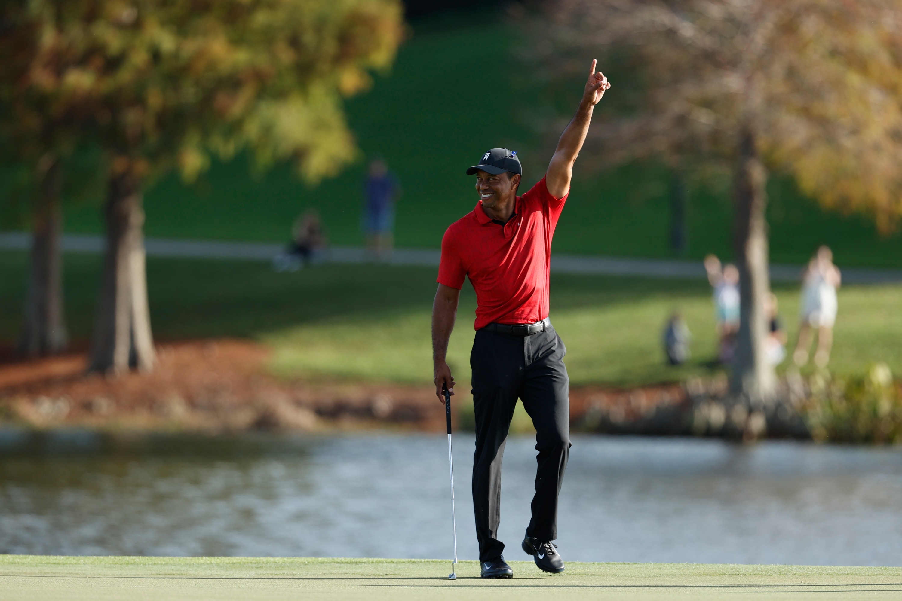 Tiger Woods reacts on the 17th green during the second round of the PNC Championship golf tournament Sunday, Dec. 19, 2021, in Orlando, Fla. (AP Photo/Scott Audette)