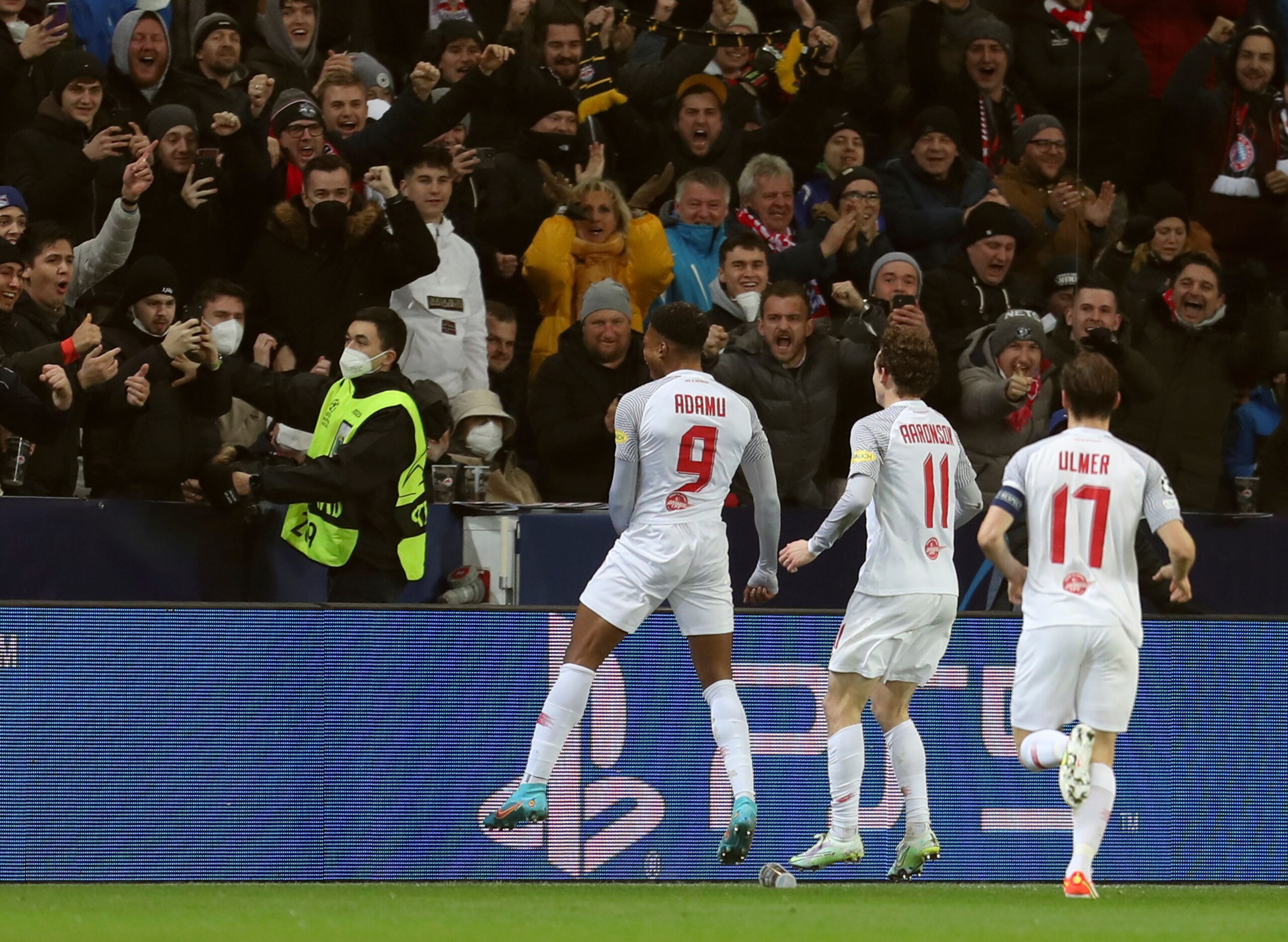 Salzburg's Chukwubuike Adamu, left, celebrates after scoring his side's opening goal during the Champions League, round of 16, first leg soccer match between Salzburg and Bayern, at the Salzburg stadium, in Salzburg, Austria, Wednesday, Feb. 16, 2022. (AP Photo/Alexandra Beier)