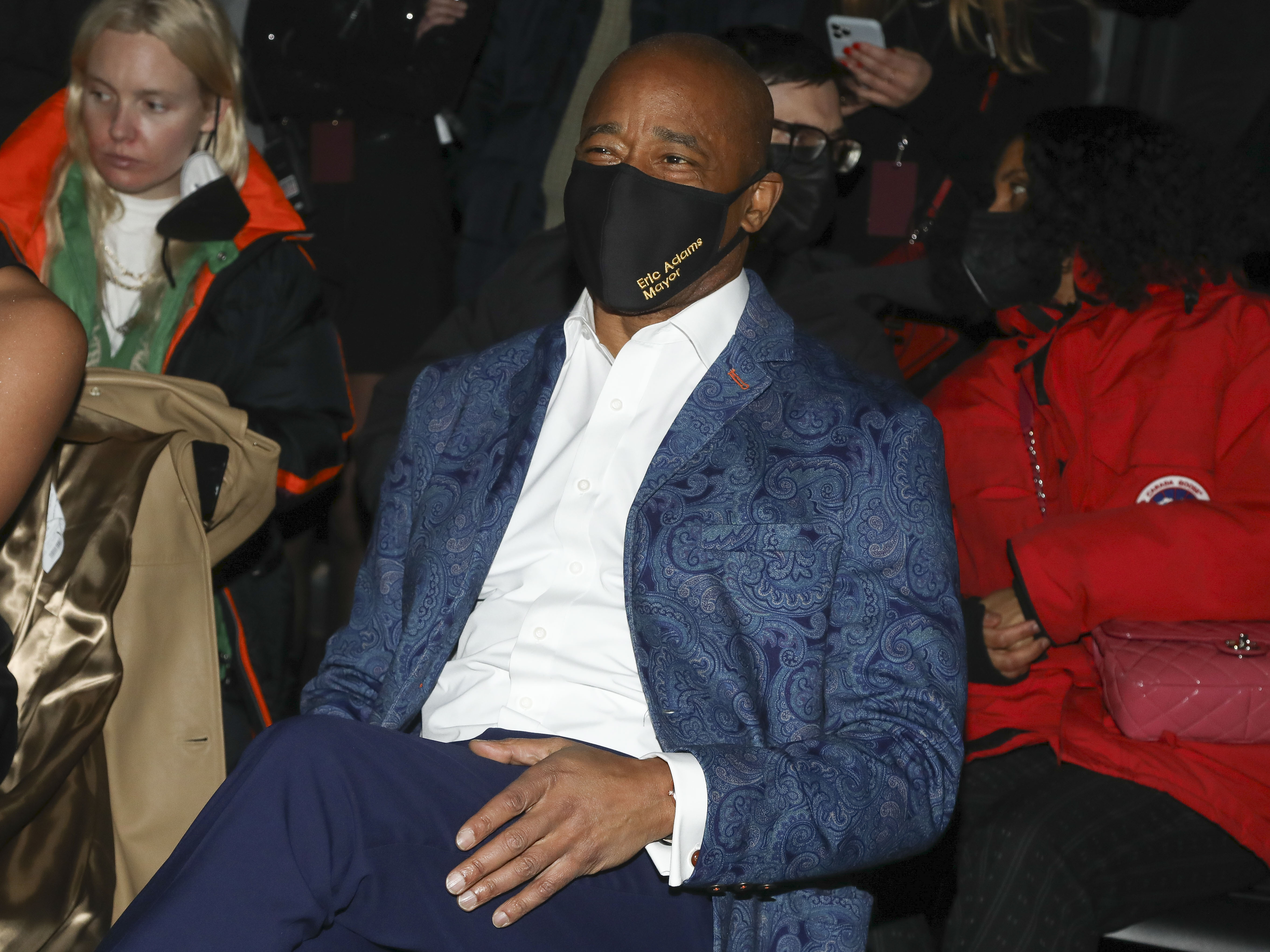 New York City Mayor Eric Adams sits in the front row at the NYFW Fall/Winter 2022 Michael Kors fashion show at Terminal 5 on Tuesday, Feb. 15, 2022, in New York. (Photo by Andy Kropa/Invision/AP)