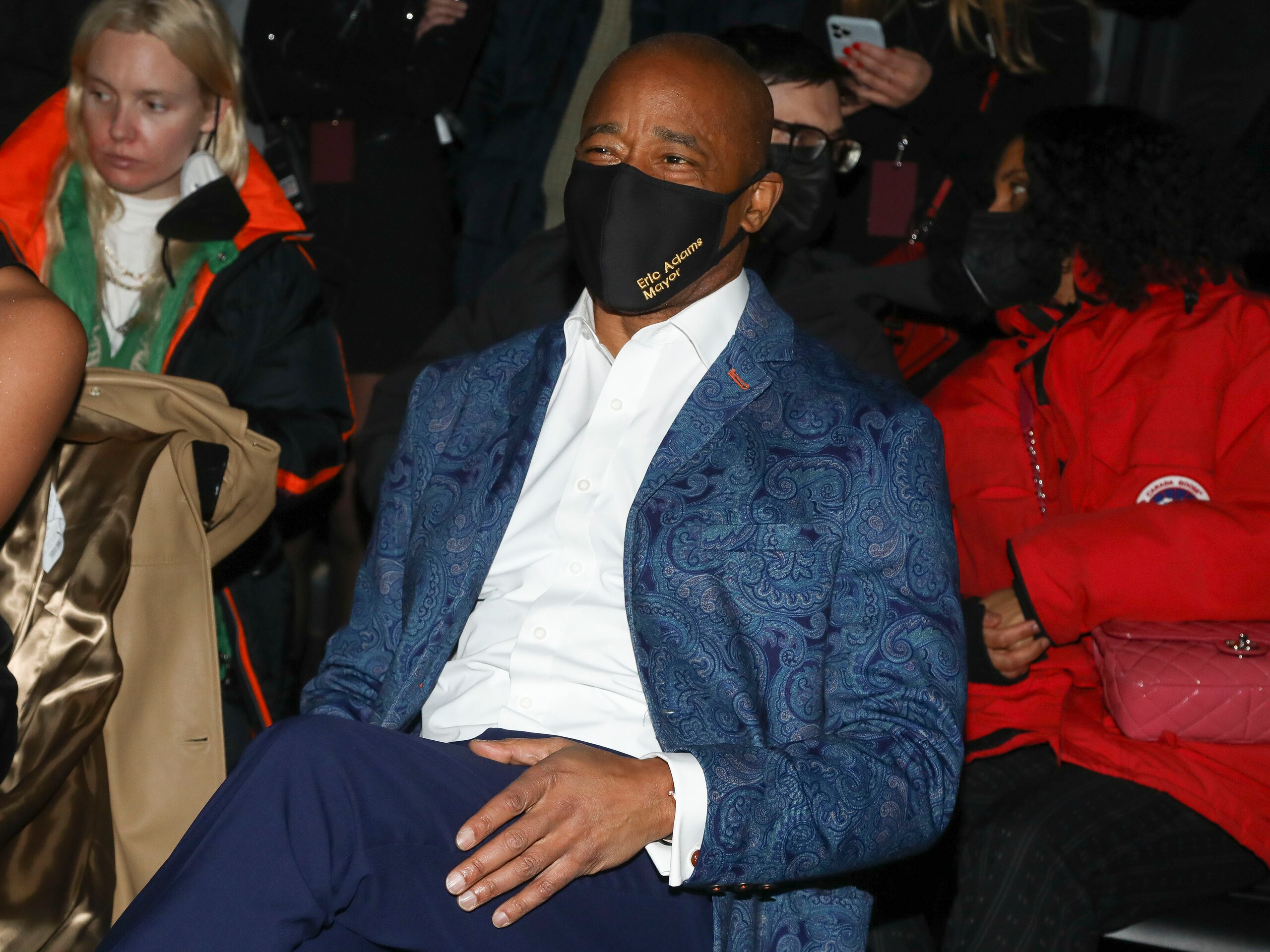New York City Mayor Eric Adams sits in the front row at the NYFW Fall/Winter 2022 Michael Kors fashion show at Terminal 5 on Tuesday, Feb. 15, 2022, in New York. (Photo by Andy Kropa/Invision/AP)
