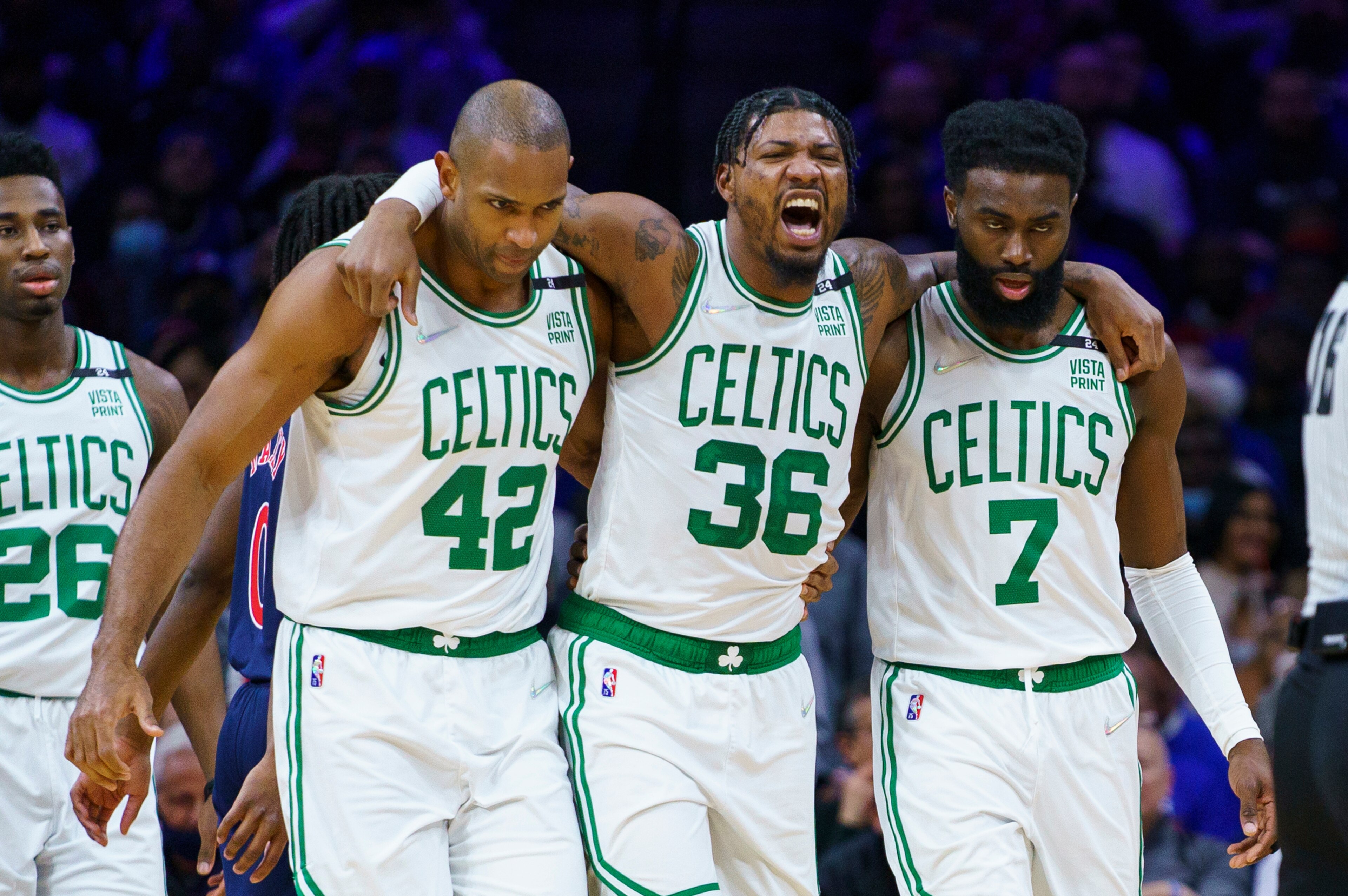 Boston Celtics' Marcus Smart, center, gets helped off the court by Al Horford, left, and Jaylen Brown, right, during the first half of the team's NBA basketball game against the Philadelphia 76ers, Tuesday, Feb. 15, 2022, in Philadelphia. (AP Photo/Chris Szagola) Boston Celtics' Marcus Smart, center, gets helped off the court by Al Horford, left, and Jaylen Brown, right, during the first half of the team's NBA basketball game against the Philadelphia 76ers, Tuesday, Feb. 15, 2022, in Philadelphia. (AP Photo/Chris Szagola)