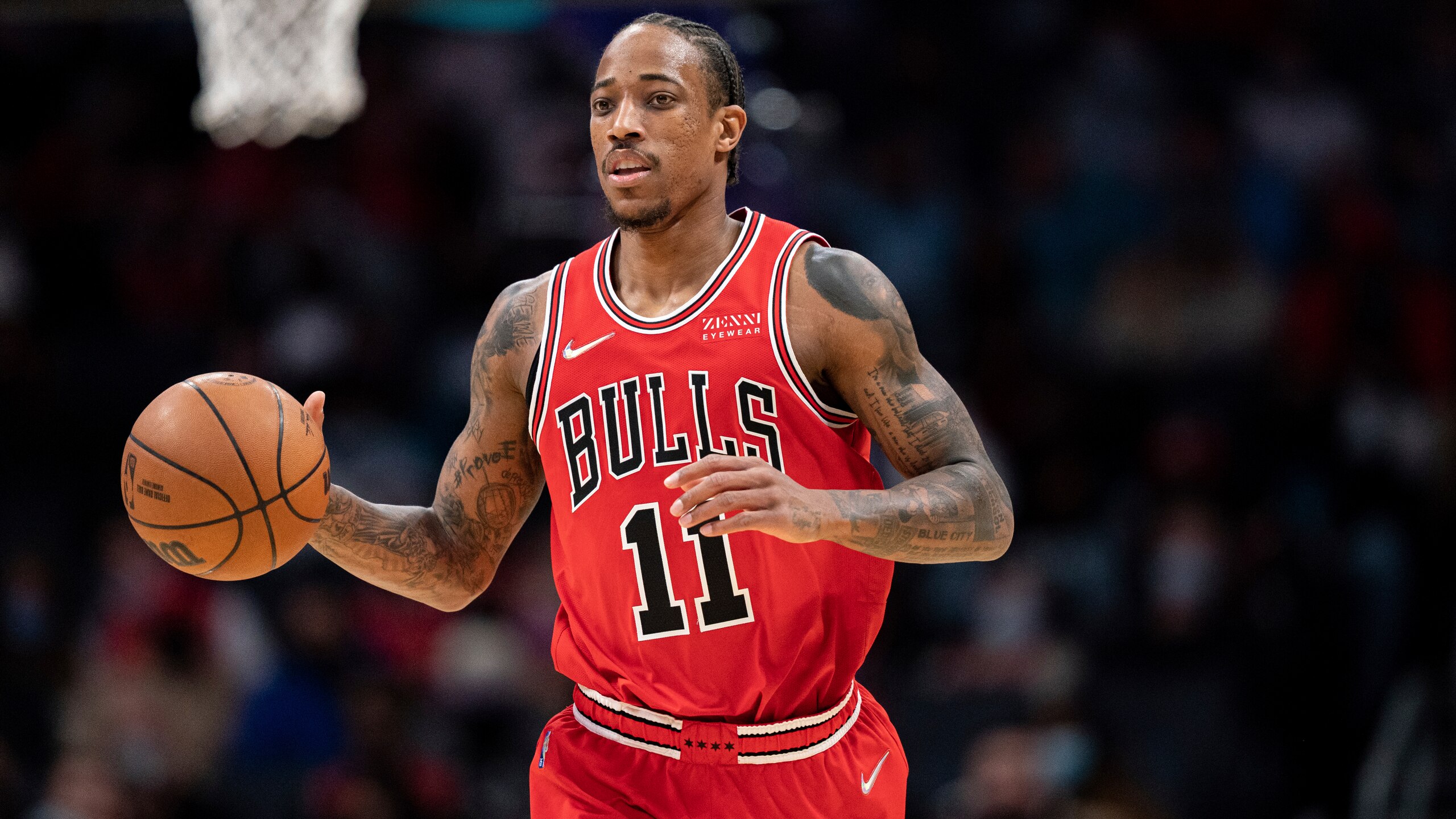 Chicago Bulls forward DeMar DeRozan (11) brings the ball up court against the Charlotte Hornets during the first half of an NBA basketball game in Charlotte, N.C., Wednesday, Feb. 9, 2022. (AP Photo/Jacob Kupferman)