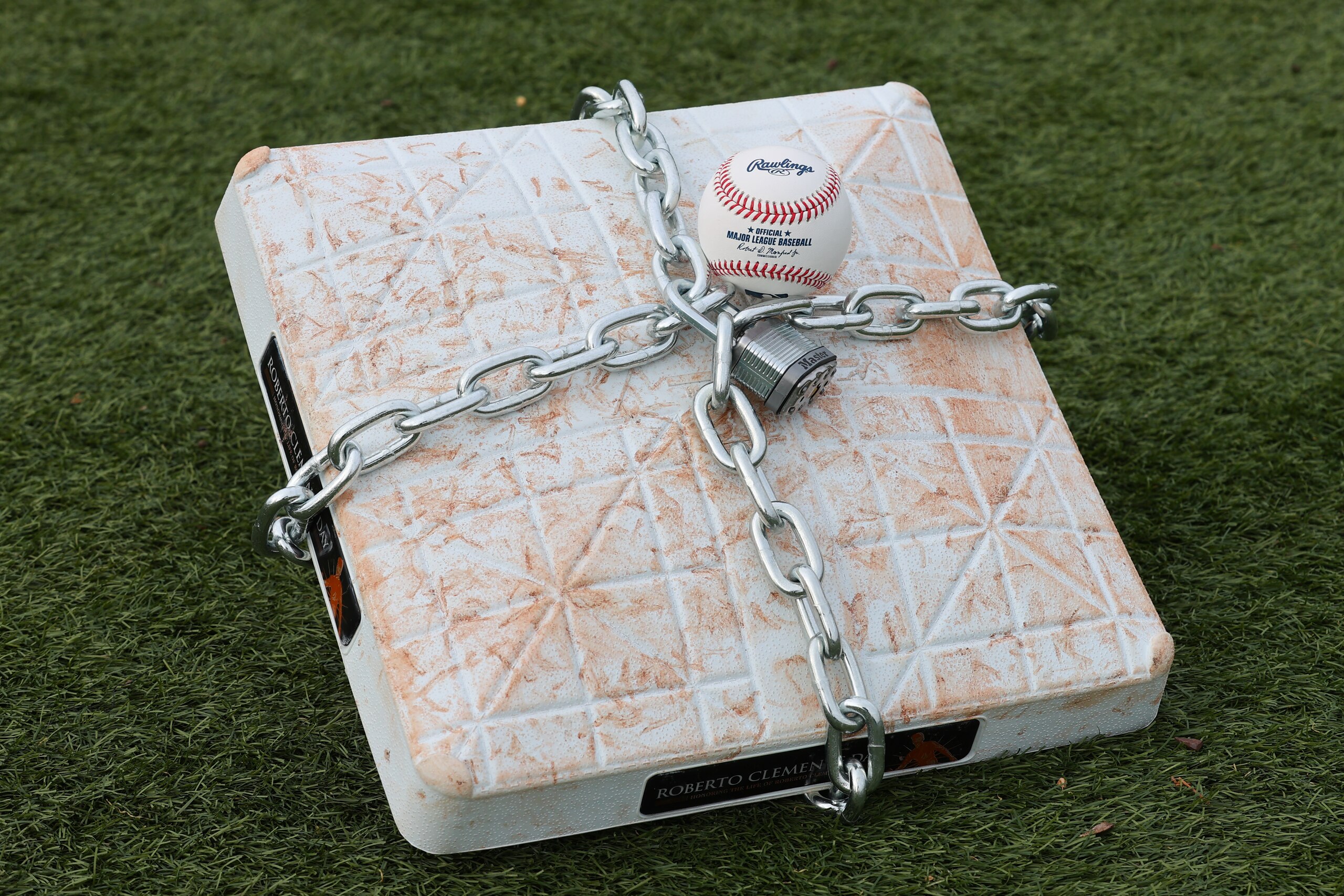 LINCROFT, NJ - JANUARY 28:  An official MLB baseball sits on top of an MLB game-used base with a lock and chain around it to represent the lockout between Major League Baseball (MLB) and the Major League Baseball Players Association (MLBPA) on January 28, 2022  in Lincroft, New Jersey.  (Photo by Rich Graessle/Icon Sportswire via Getty Images)