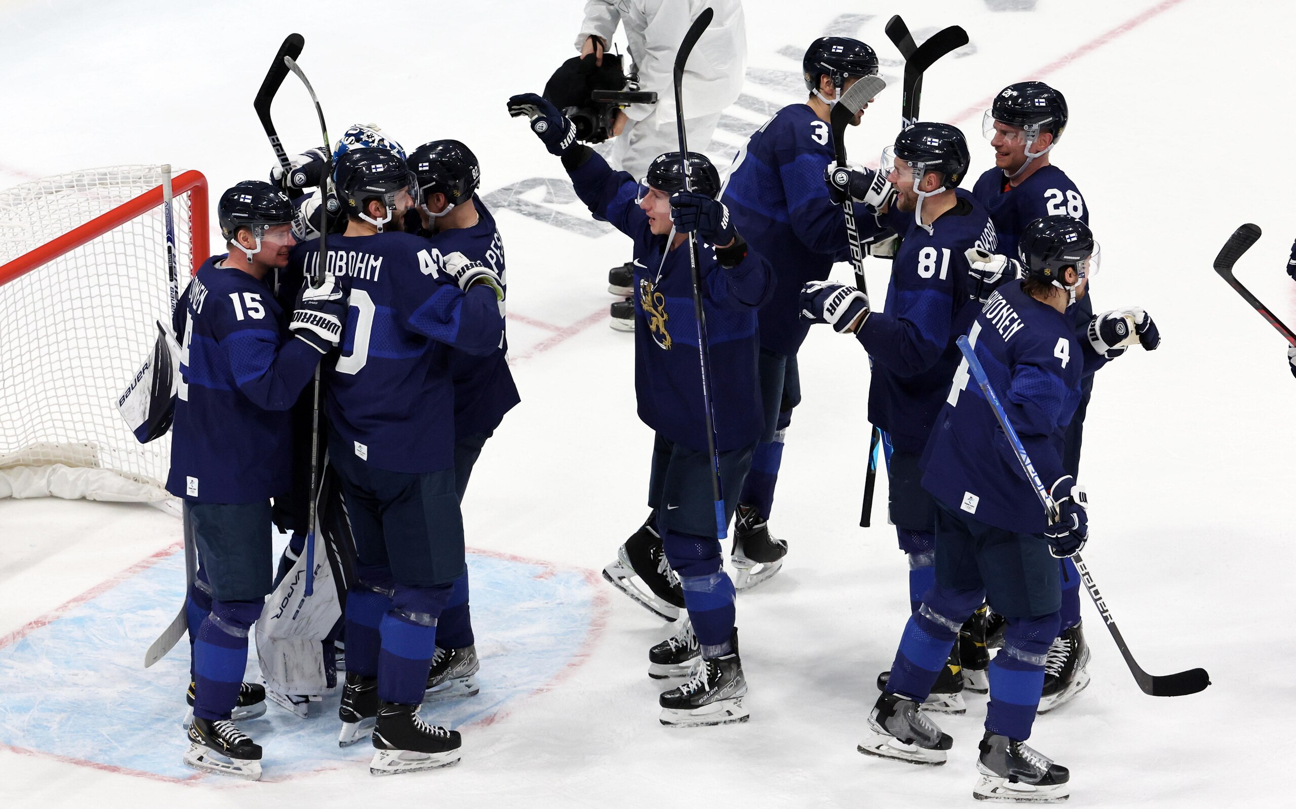 BEIJING, CHINA - FEBRUARY 18: Players of Team Finland celebrate the victory during the Men's Ice Hockey Playoff Semifinal match between Team Finland and Team Slovakia on Day 14 of the Beijing 2022 Winter Olympic Games at National Indoor Stadium on February 18, 2022 in Beijing, China. (Photo by Xavier Laine/Getty Images)