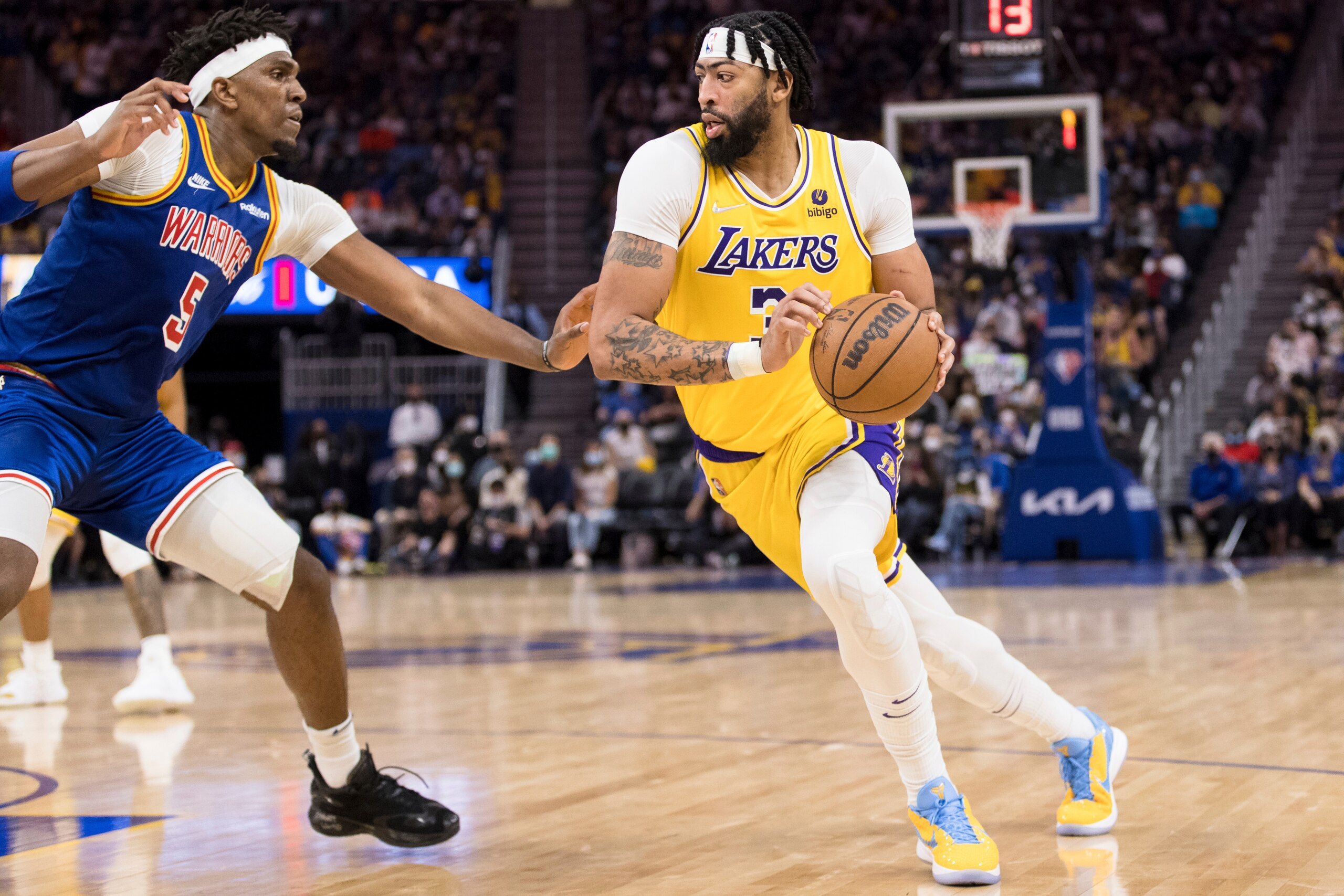 Los Angeles Lakers forward Anthony Davis (3) drives past Golden State Warriors center Kevon Looney (5) during the first half of an NBA basketball game in San Francisco, Saturday, Feb. 12, 2022. The Warriors won 117-115. (AP Photo/John Hefti) Los Angeles Lakers forward Anthony Davis (3) drives past Golden State Warriors center Kevon Looney (5) during the first half of an NBA basketball game in San Francisco, Saturday, Feb. 12, 2022. The Warriors won 117-115. (AP Photo/John Hefti)