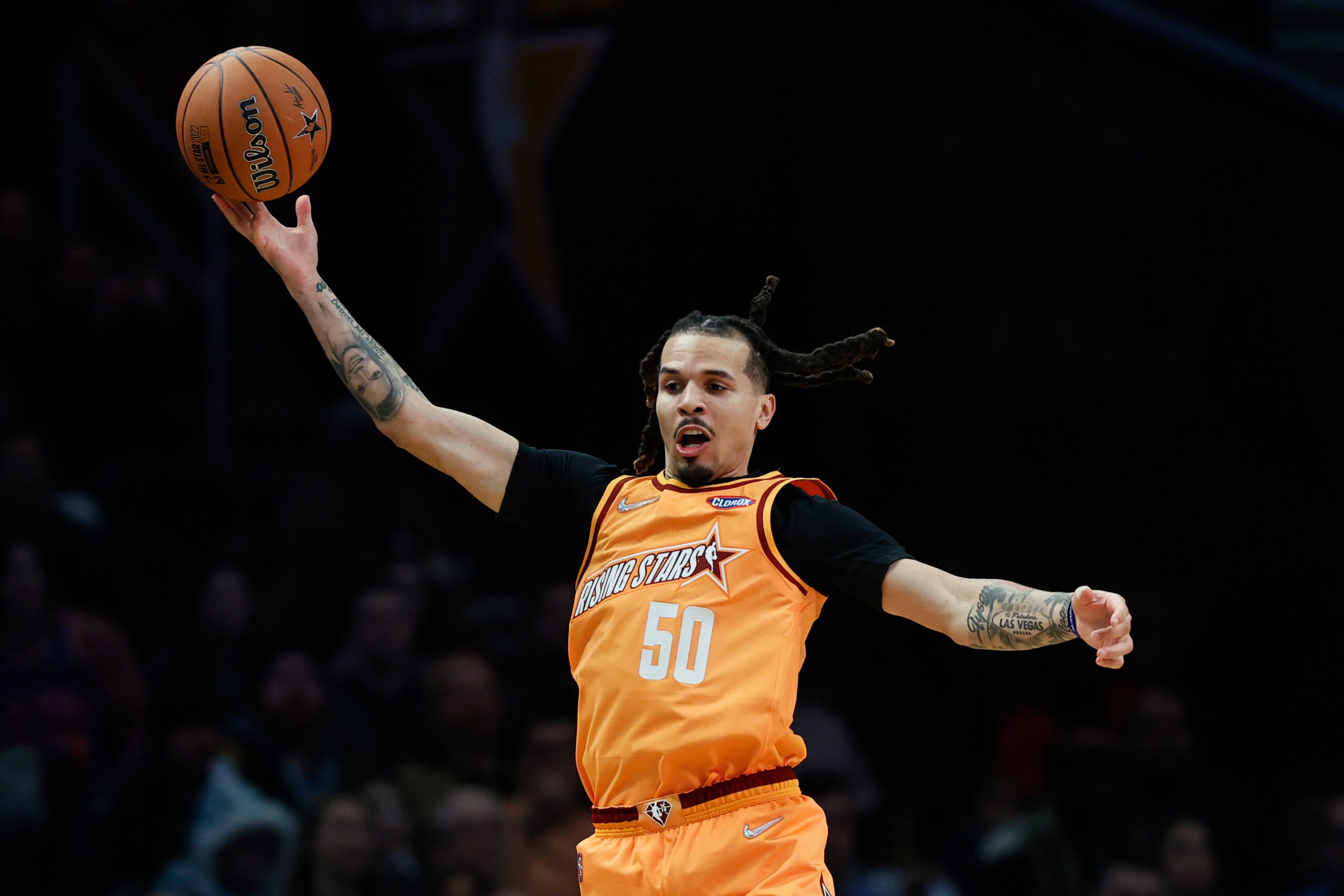 Team Worthy's Cole Anthony, of the Orlando Magic, saves the ball from going out of bounds during a semifinal of the NBA basketball Rising Stars event against Team Isiah, Friday, Feb. 18, 2022, in Cleveland. (AP Photo/Ron Schwane) Team Worthy's Cole Anthony, of the Orlando Magic, saves the ball from going out of bounds during a semifinal of the NBA basketball Rising Stars event against Team Isiah, Friday, Feb. 18, 2022, in Cleveland. (AP Photo/Ron Schwane)