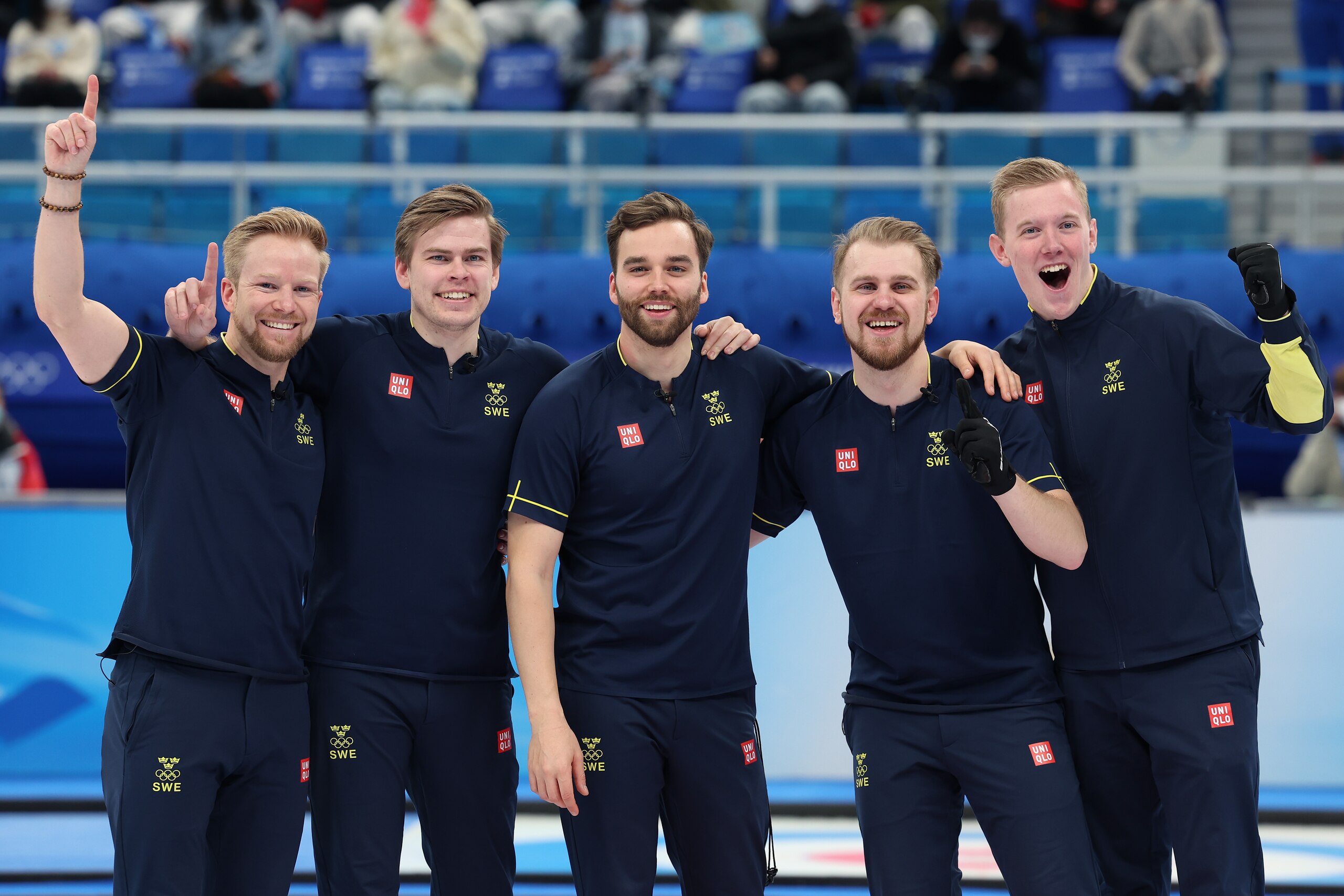 BEIJING, CHINA - FEBRUARY 19: (L-R) Niklas Edin, Christoffer Sundgren, Oskar Eriksson, Rasmus Wranaa and Daniel Magnusson of Team Sweden celebrate winning gold against Team Great Britain during the Men's Curling Gold Medal Game on Day 14 of the Beijing 2022 Winter Olympic Games at National Aquatics Centre on February 19, 2022 in Beijing, China. (Photo by Lintao Zhang/Getty Images)