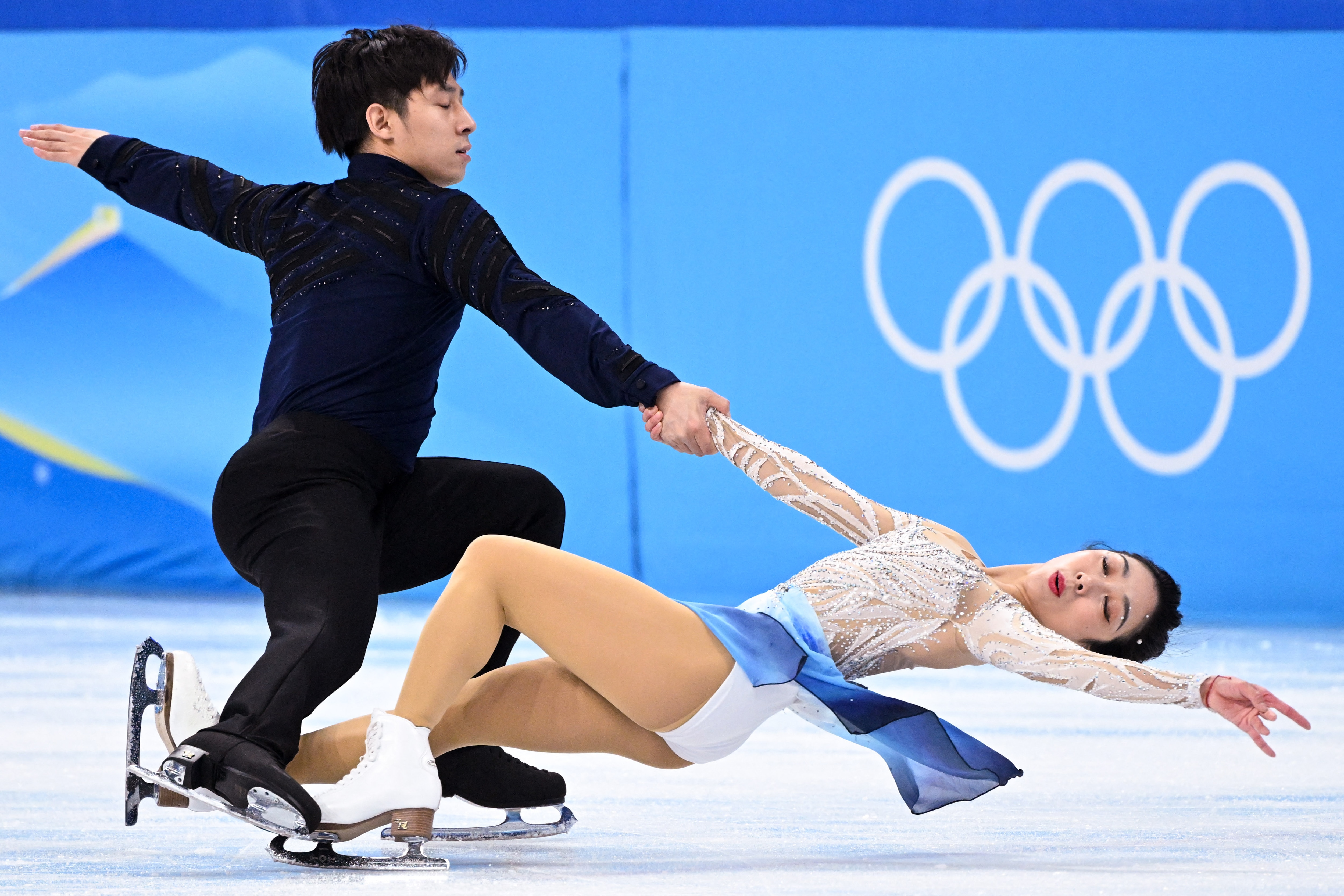 China's Sui Wenjing and China's Han Cong compete in the pair skating free skating of the figure skating event during the Beijing 2022 Winter Olympic Games at the Capital Indoor Stadium in Beijing on February 19, 2022. (Photo by Kirill KUDRYAVTSEV / AFP) (Photo by KIRILL KUDRYAVTSEV/AFP via Getty Images)