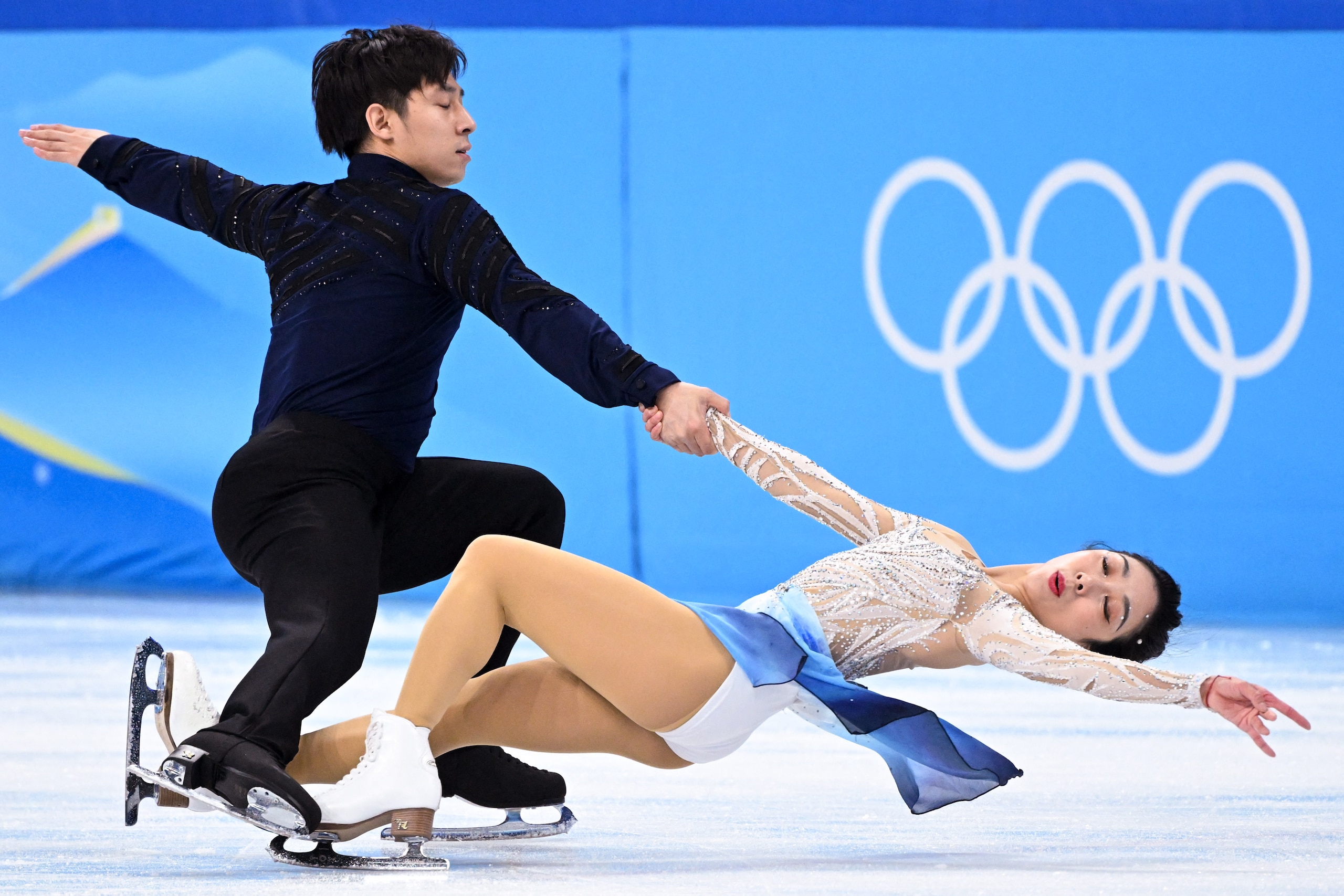 China's Sui Wenjing and China's Han Cong compete in the pair skating free skating of the figure skating event during the Beijing 2022 Winter Olympic Games at the Capital Indoor Stadium in Beijing on February 19, 2022. (Photo by Kirill KUDRYAVTSEV / AFP) (Photo by KIRILL KUDRYAVTSEV/AFP via Getty Images)