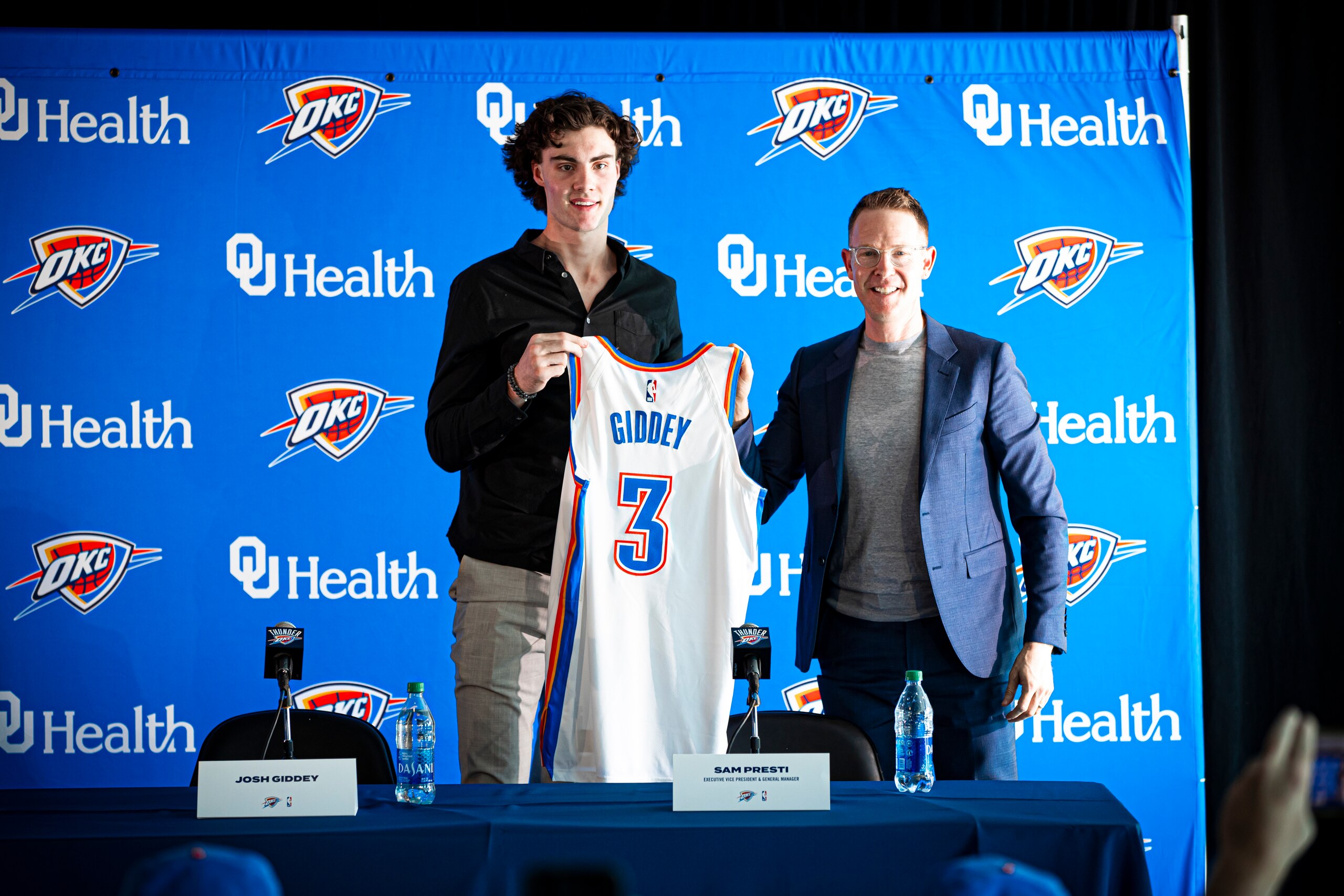 OKLAHOMA CITY, OK - JULY 31: Josh Giddey #3 of Oklahoma City Thunder poses for a photo with General Manager, Sam Presti during the press conference on July 31, 2021 at Paycom Center in Oklahoma City, Oklahoma. NOTE TO USER: User expressly acknowledges and agrees that, by downloading and or using this photograph, User is consenting to the terms and conditions of the Getty Images License Agreement. Mandatory Copyright Notice: Copyright 2021 NBAE (Photo by Zach Beeker/NBAE via Getty Images)