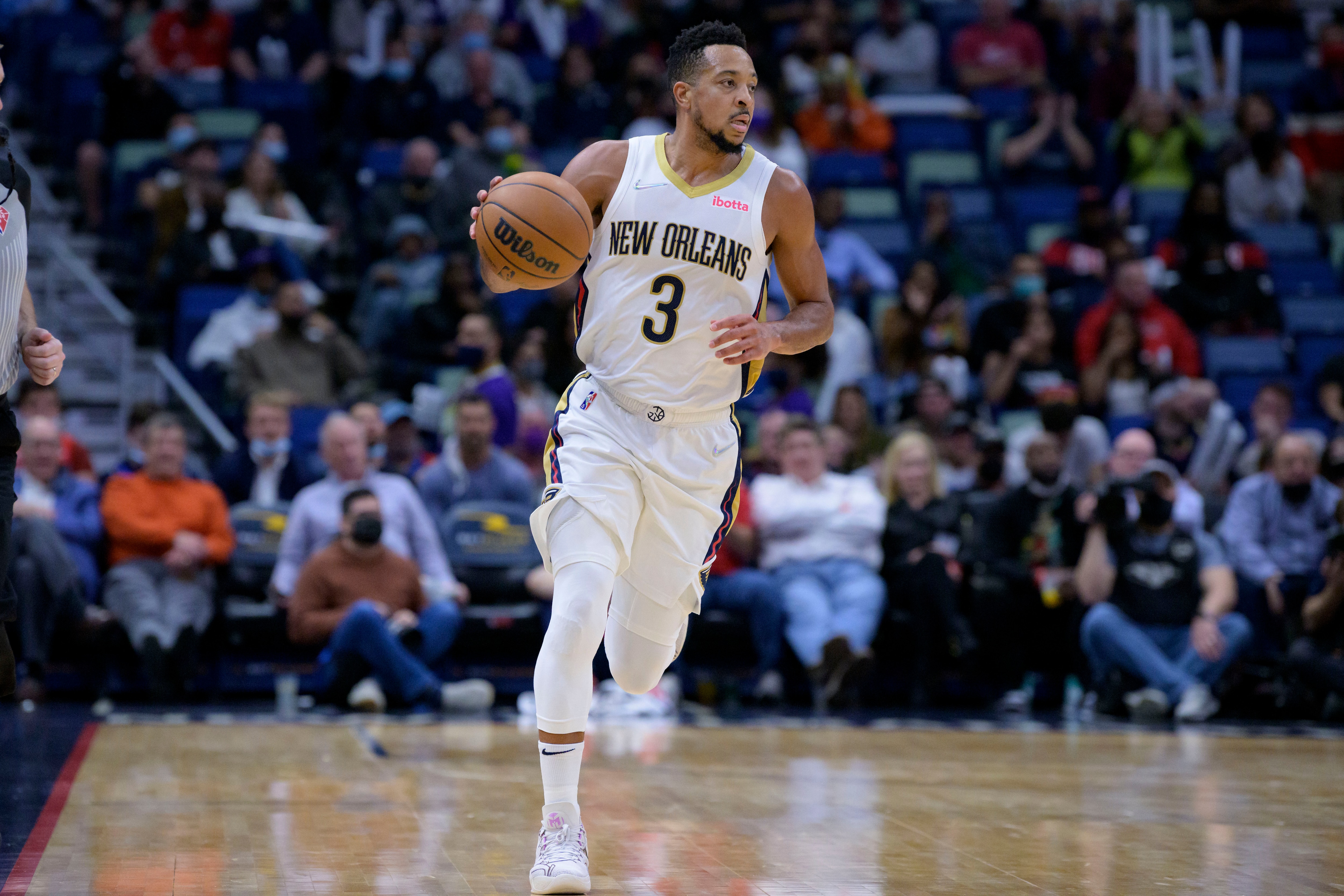 New Orleans Pelicans guard CJ McCollum (3) dribbles during an NBA basketball game against the Dallas Mavericks in New Orleans, Thursday, Feb. 17, 2022. (AP Photo/Matthew Hinton)