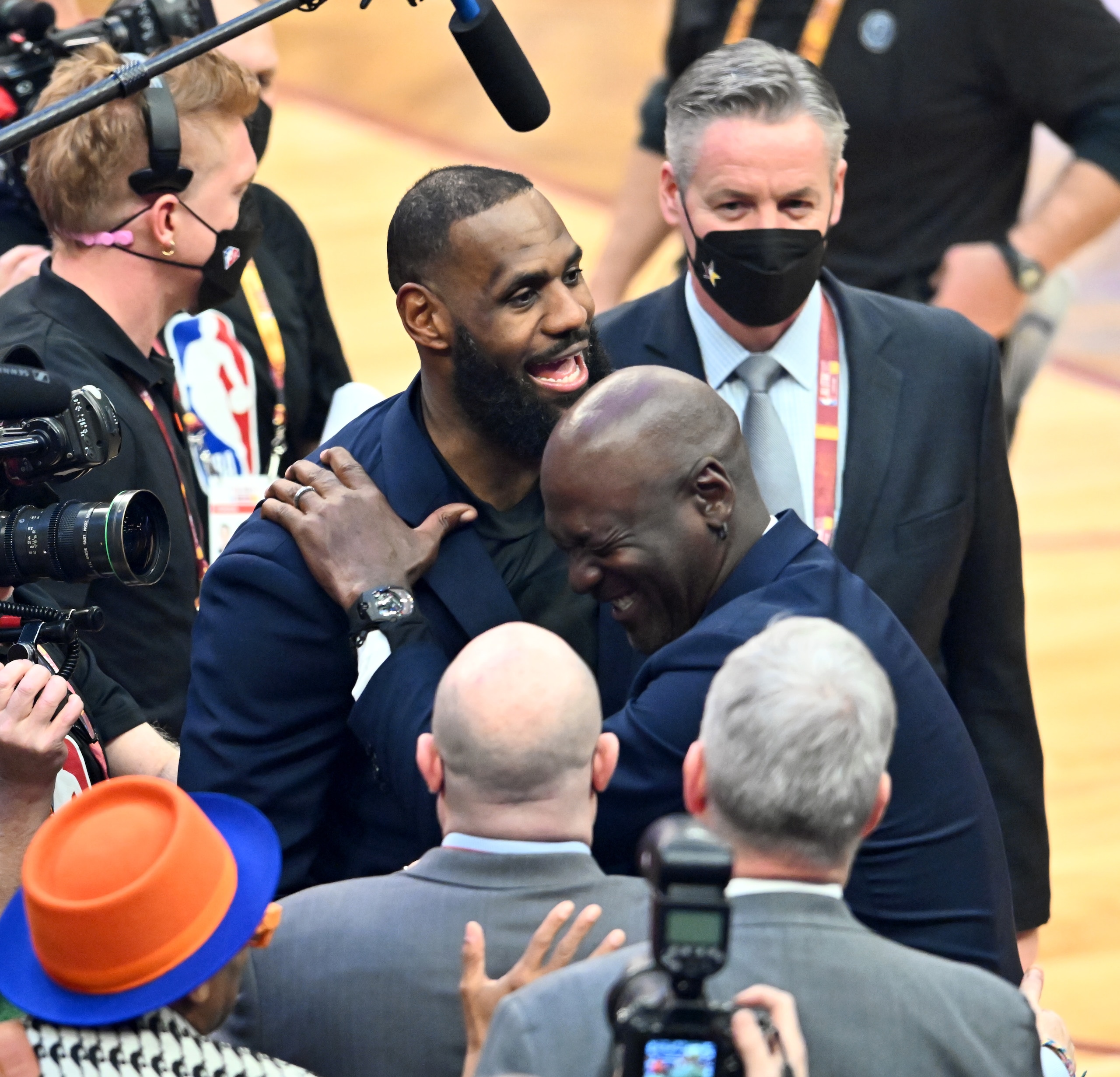 CLEVELAND, OHIO - FEBRUARY 20: Michael Jordan and LeBron James hug after the presentation of the NBA 75th Anniversary Team during the 2022 NBA All-Star Game at Rocket Mortgage Fieldhouse on February 20, 2022 in Cleveland, Ohio. NOTE TO USER: User expressly acknowledges and agrees that, by downloading and or using this photograph, User is consenting to the terms and conditions of the Getty Images License Agreement. (Photo by Jason Miller/Getty Images)